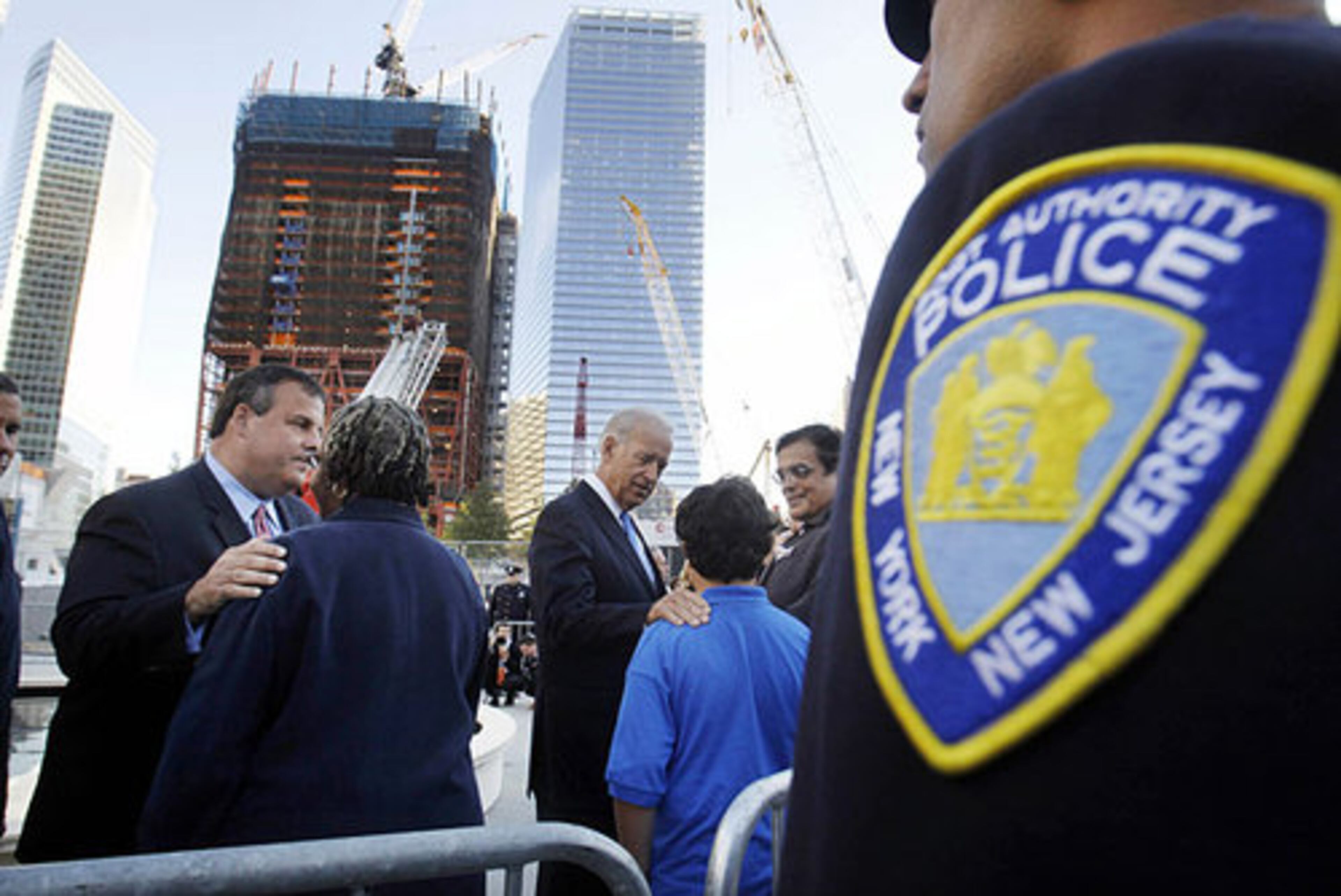 New Jersey Governor Chris Christie, left, and Vice President Joe Biden, center, greet family members who lost loved ones in the Sept. 11, 2001 terrorist attacks on the World Trade Center during a memorial service commemorating the ninth anniversary of the attacks Saturday, Sept. 11, 2010 in New York.