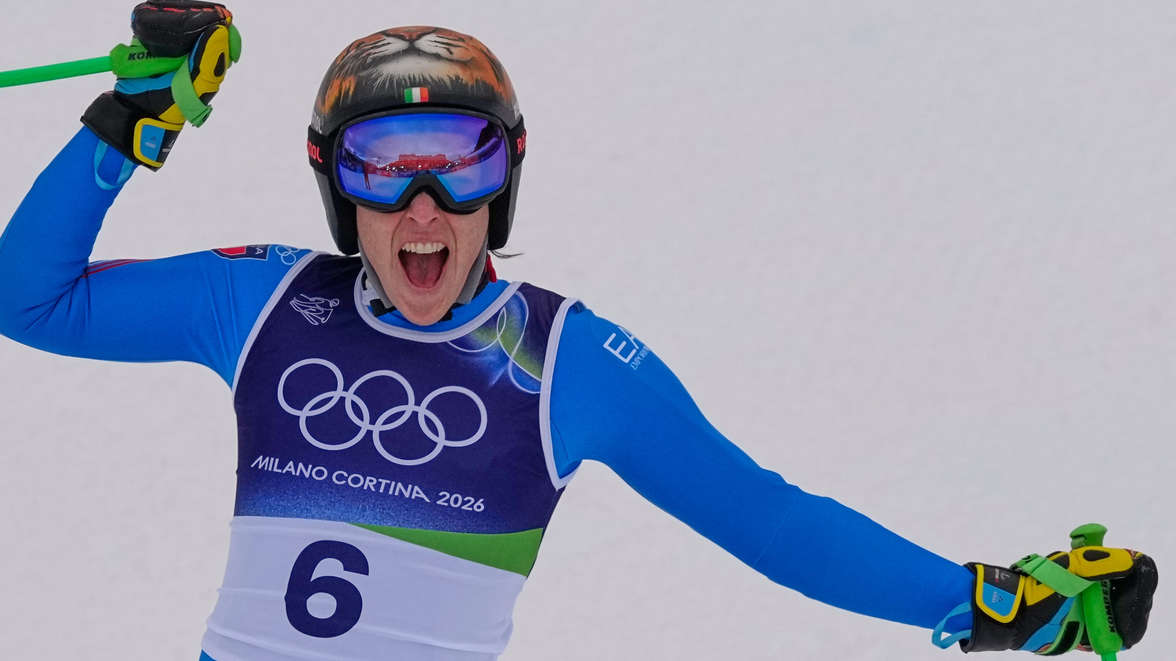 Italy's Federica Brignone reacts in the finish area, during an alpine ski, women's super-G race, at the 2026 Winter Olympics, in Cortina d'Ampezzo, Italy, Thursday, Feb. 12, 2026. (AP Photo/Andy Wong)