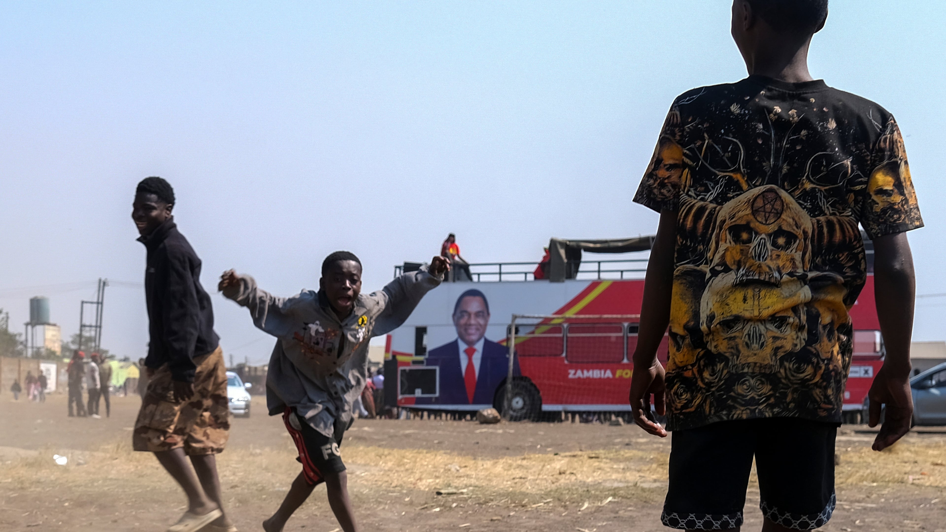 Supporters of Zambian incumbent President and United Party for National Development (UPND) presidential candidate Hakainde Hichilema attend a campaign rally on the outskirts of Lusaka, Zambia, Saturday, Aug. 8, 2026. (AP Photo/Anita Reed)