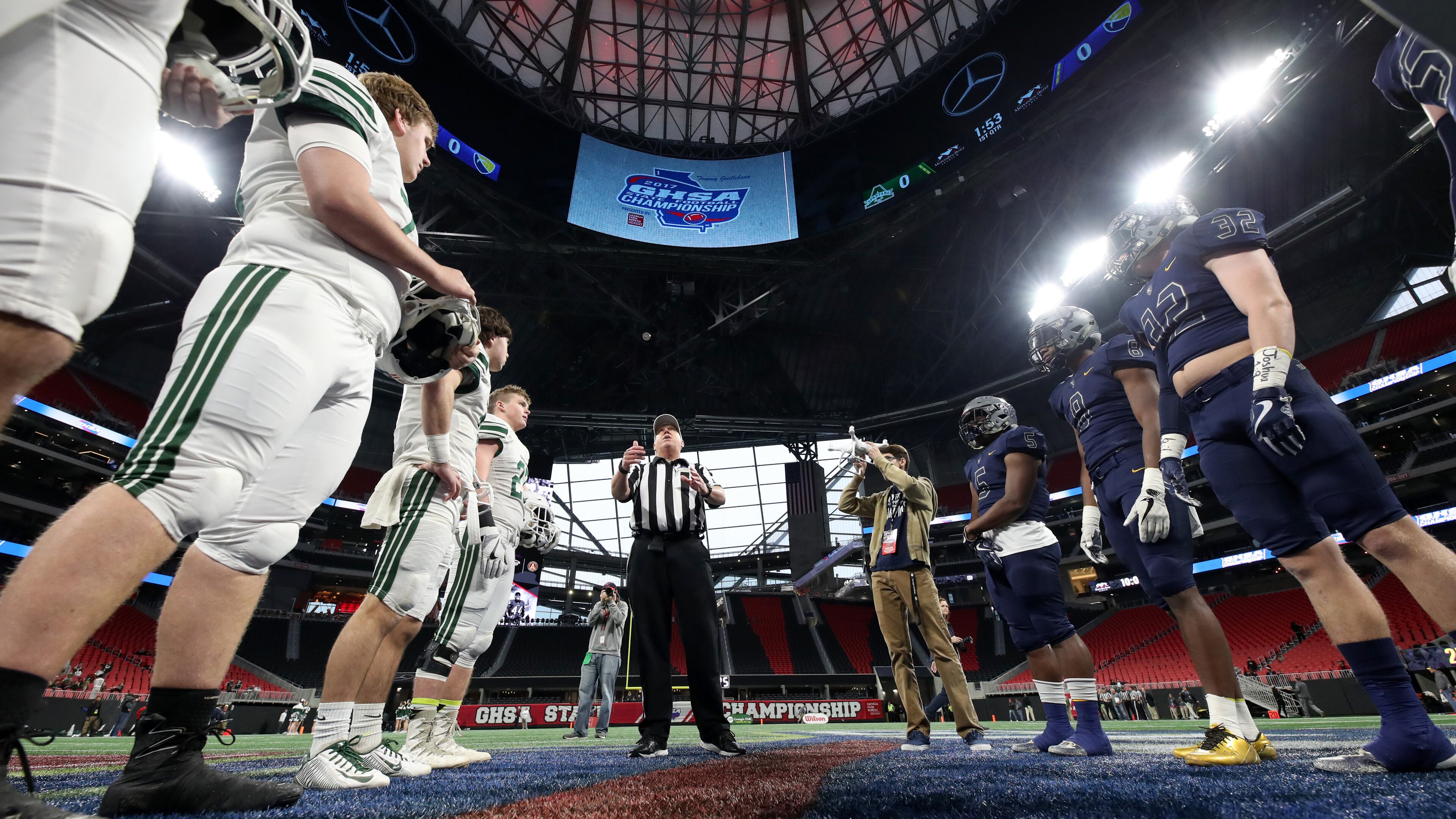 Eagle's Landing Christian and Athens Academy met for the coin toss prior to Friday's Class A private title game at Mercedes-Benz Stadium. Two of Friday's games and all four of Saturday's games were postponed because of winter weather.