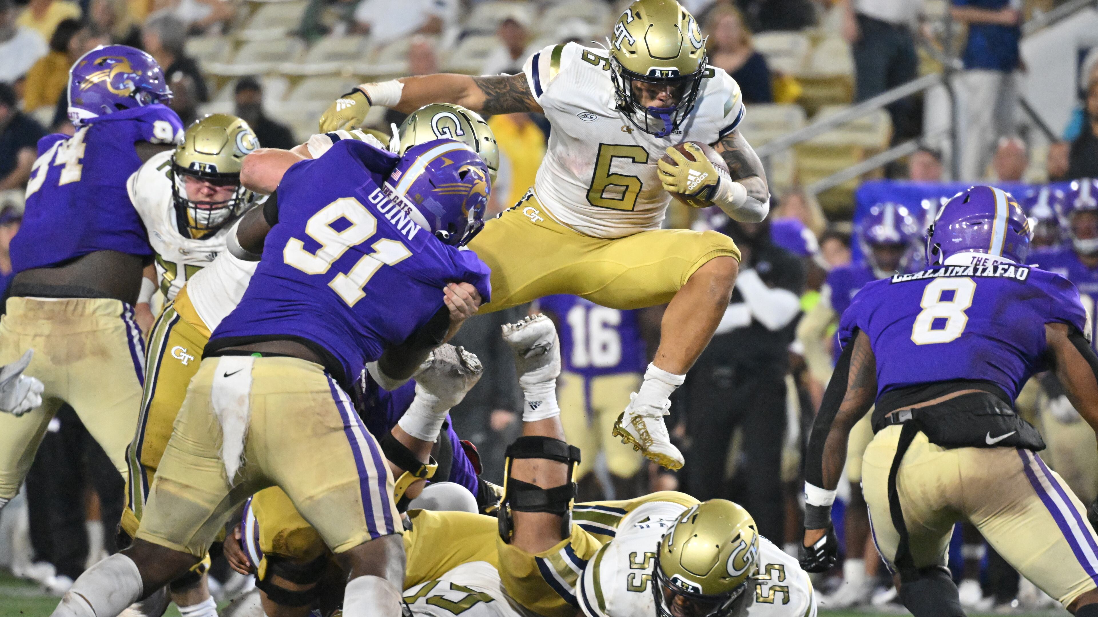 Georgia Tech running back Dylan McDuffie (6) leaps over for yardage during the second half at Bobby Dodd Stadium in Atlanta on Saturday, September 10, 2022. Georgia Tech won 35-17 over Western Carolina. (Hyosub Shin / Hyosub.Shin@ajc.com)