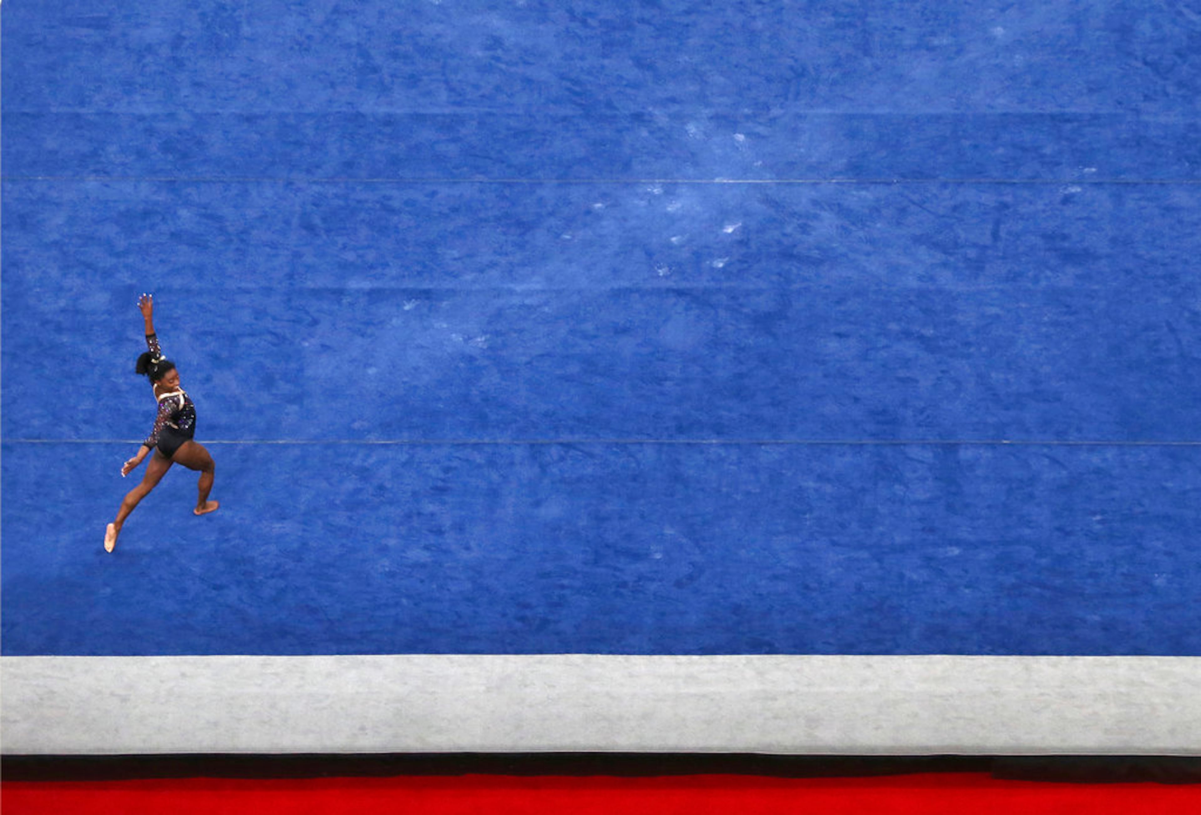 Simone Biles competes on the floor exercise at the U.S. Gymnastics Championships, Friday, Aug. 17, 2018, in Boston. (AP Photo/Elise Amendola)