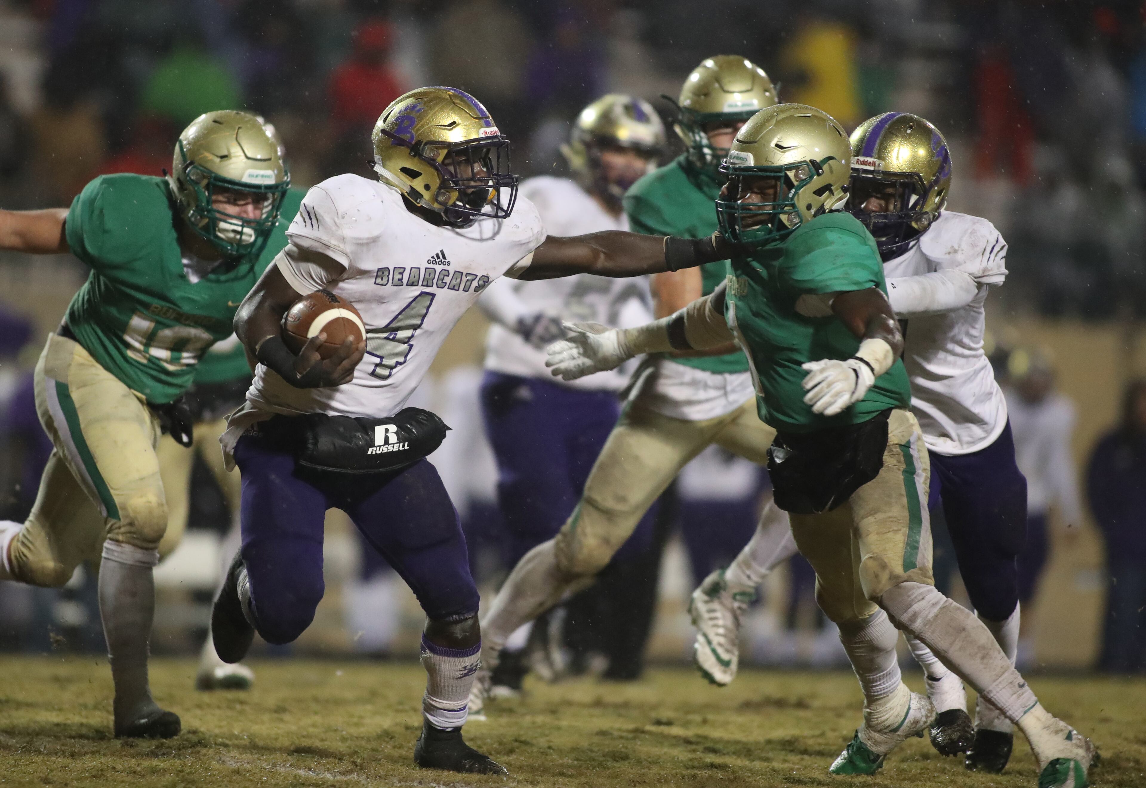 November 23, 2018 - Buford, Ga: Bainbridge running back Rashad Broadax (4) stiff arms Buford defensive back Jamaal Singleton (1) on a run in the second half at Buford High School Friday, November 23, 2018, in Buford, Ga. Buford lost to Bainbridge 23-20. This is the quarter finals of the Class 5A state playoffs. (JASON GETZ/SPECIAL TO THE AJC)