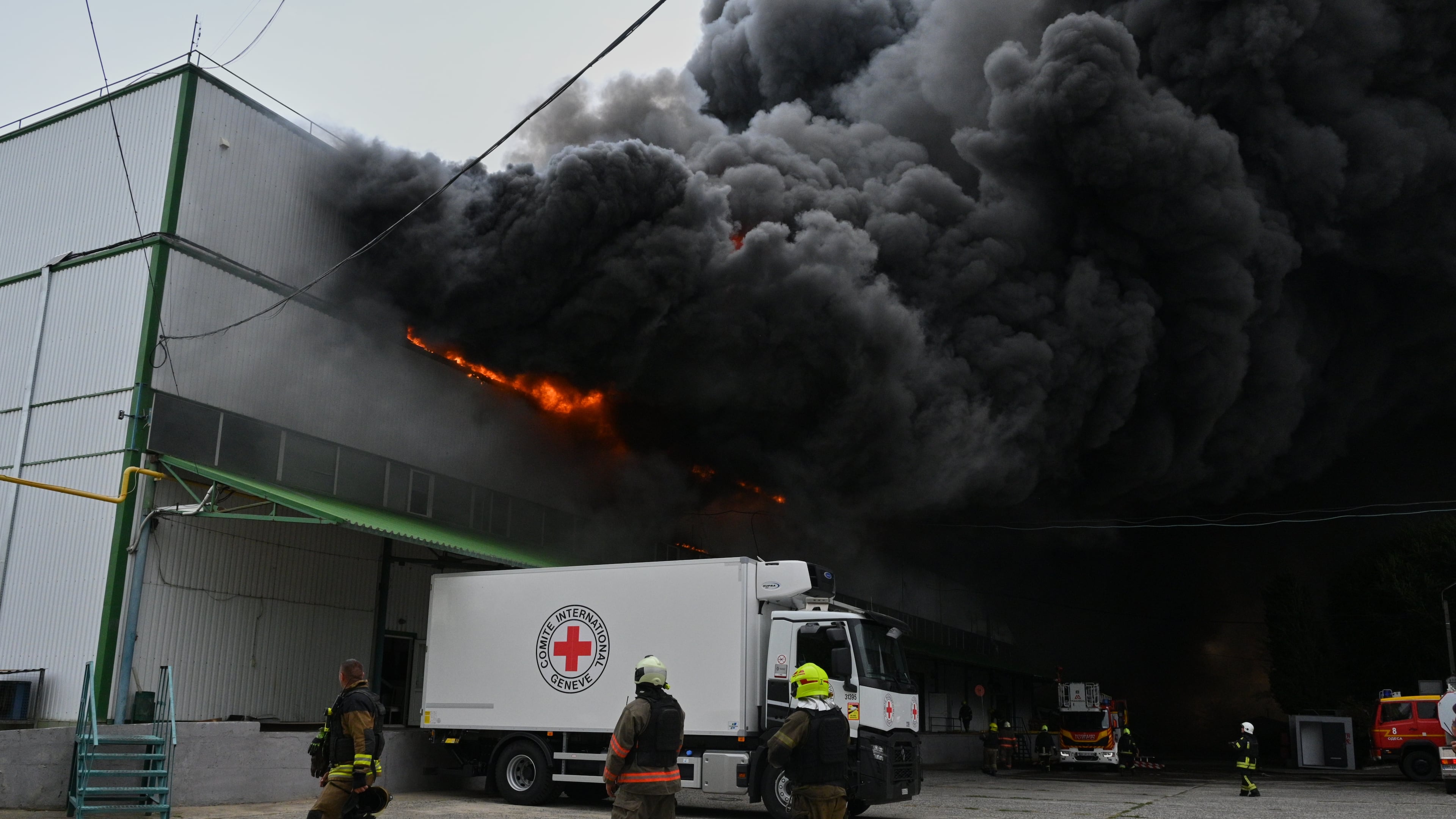 Firefighters put out a fire at warehouse stores after a Russian air attack in Odesa, Ukraine, Sunday, Sept. 13, 2026. (AP Photo/Michael Shtekel)