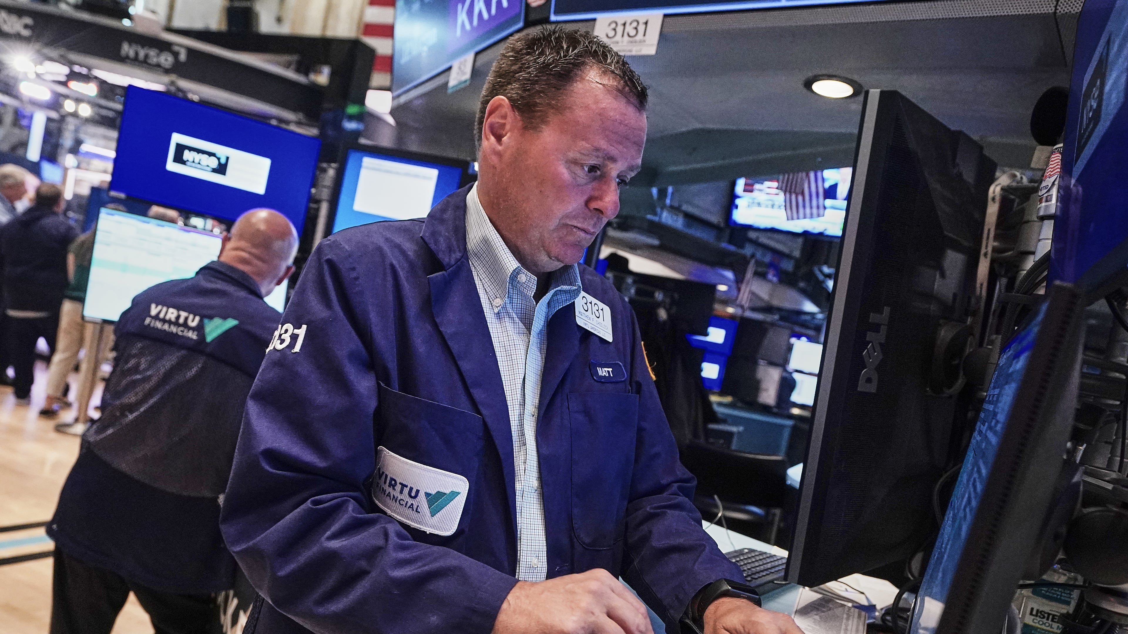 Trader Matthew Cheslock, right, works on the floor of the New York Stock Exchange, Tuesday, June 16, 2026. (AP Photo/Richard Drew)