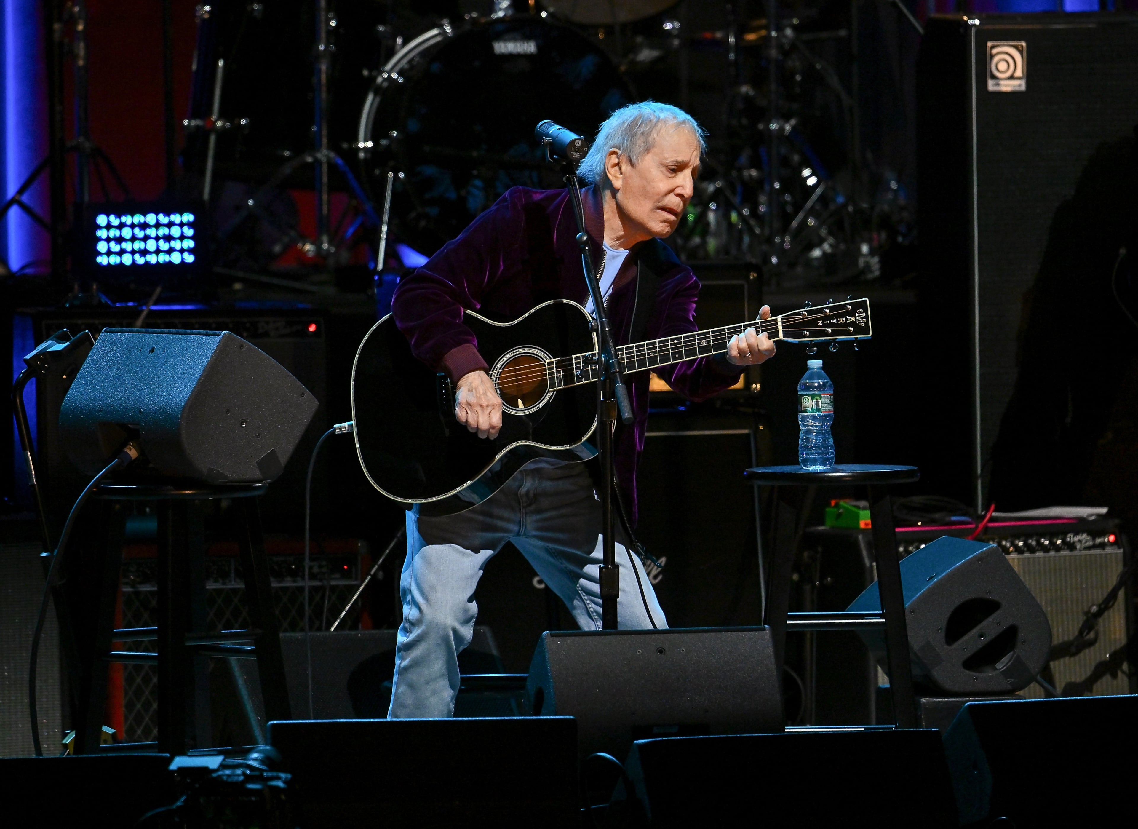 Paul Simon, pictured performing at the "Love Rocks NYC" concert in New York in March, played Synovus Bank Amphitheater at Chastain Park on Monday, July 13, 2026. (Evan Agostini/AP)