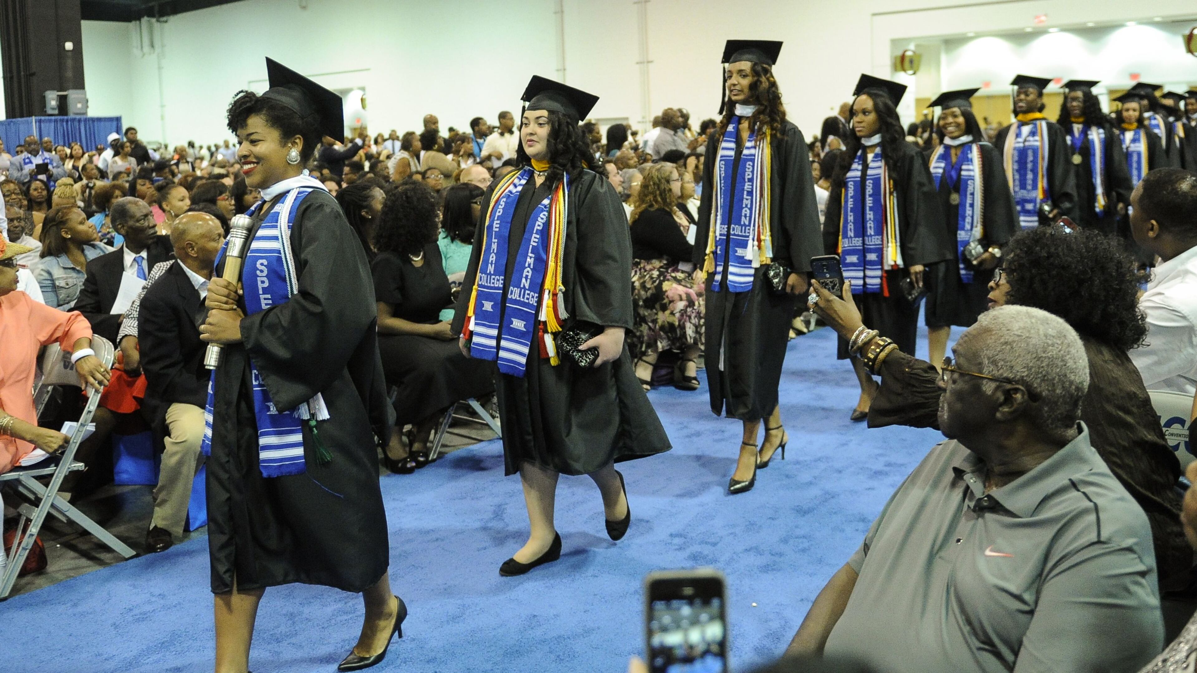 Erica Lamberson leads a group of woman entering the Spelman College commencement ceremony, Sunday, May 17, 2015, at the Georgia International Convention Center in Atlanta. Spelman ranked 6th among the 50 best colleges for African Americans, in a new ranking from Essence and MONEY magazines.(Special/John Amis)
