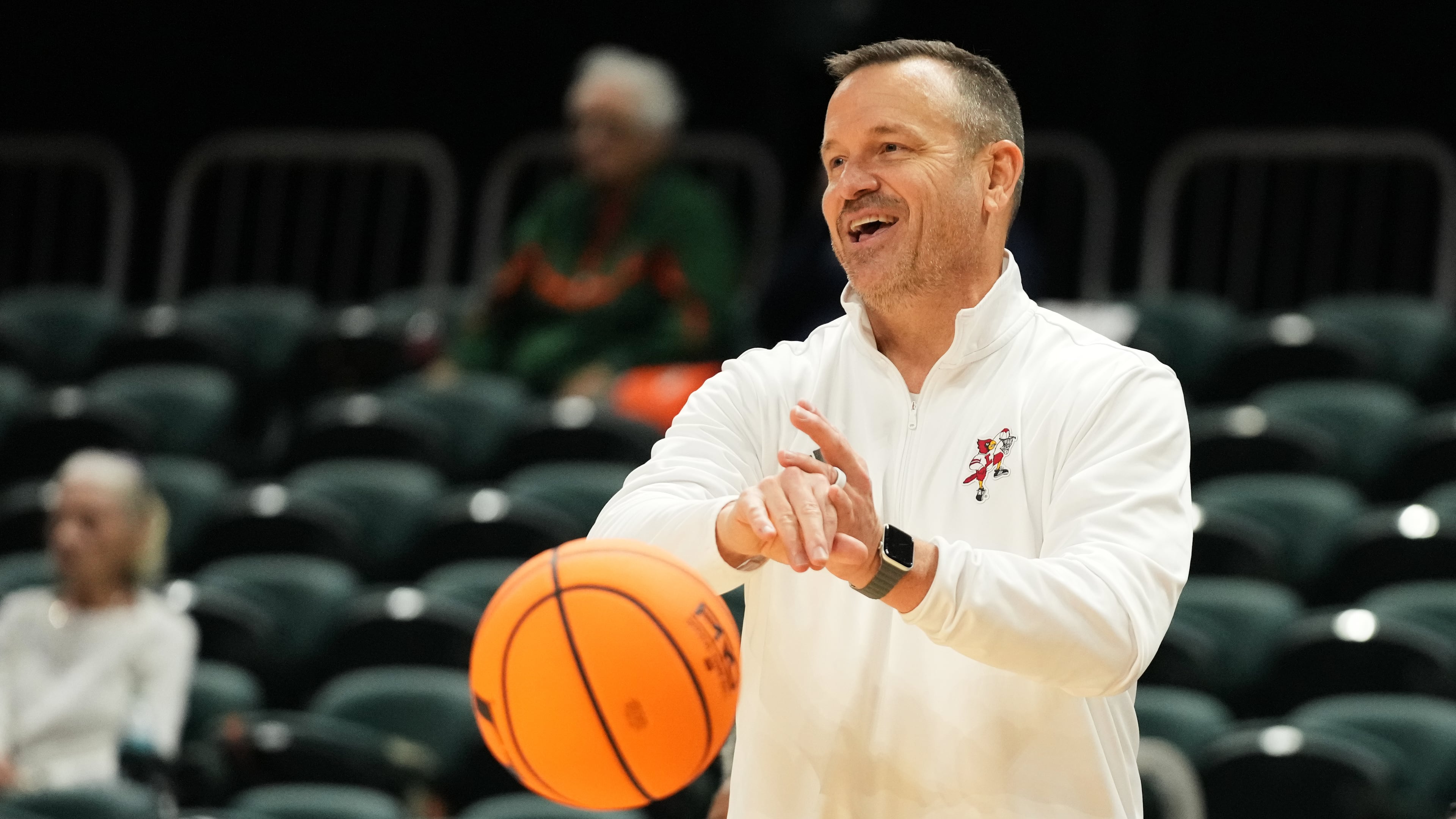 Louisville head coach Jeff Walz puts the ball back into play during the second half of an NCAA college basketball game against Miami, Thursday, Jan. 8, 2026, in Coral Gables, Fla. (AP Photo/Lynne Sladky)