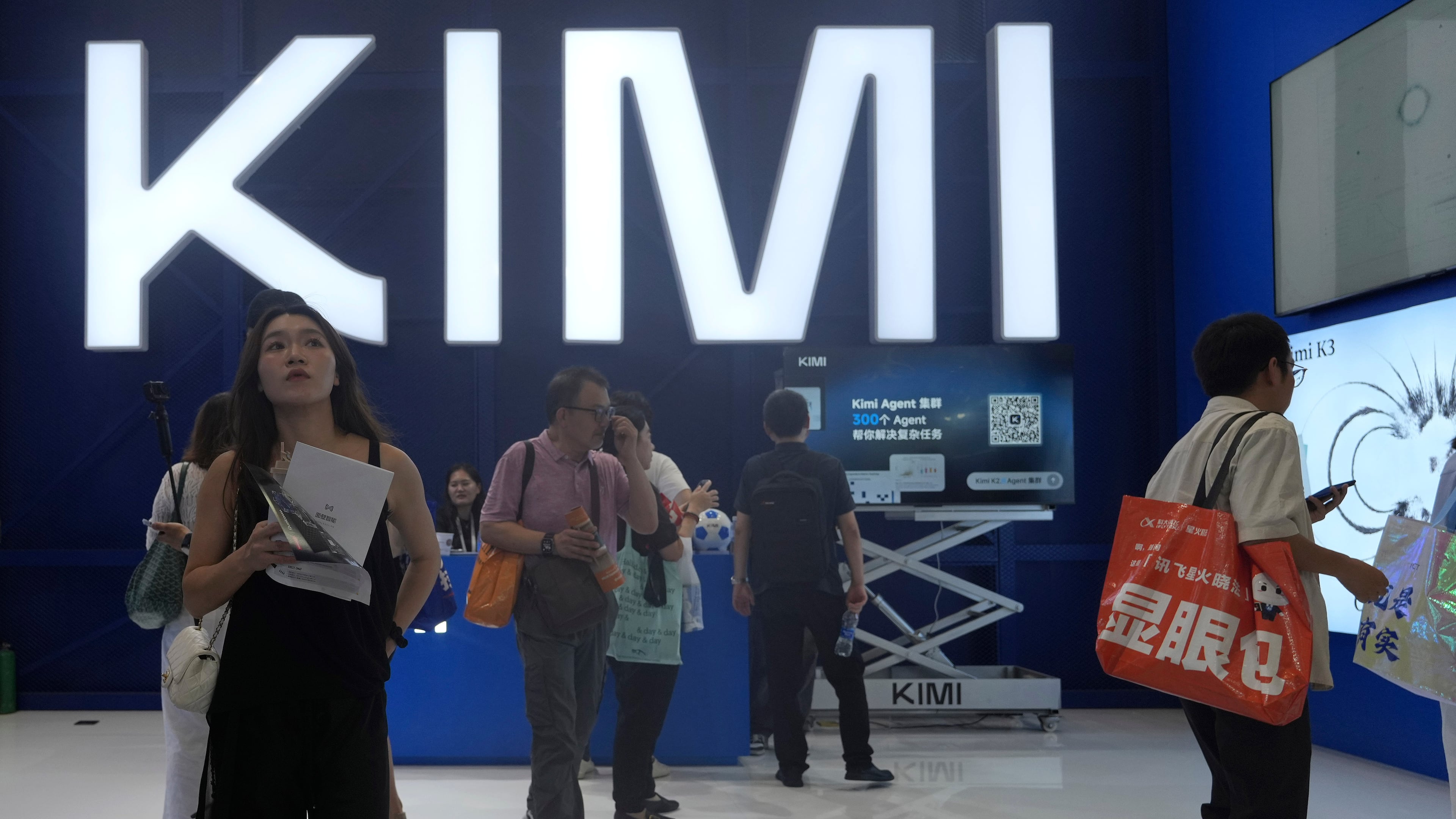 Visitors at the booth for Chinese AI Startup Moonshot's Kimi K3 during the World AI Conference in Shanghai, China on July 17, 2026. (AP Photo/Ng Han Guan)