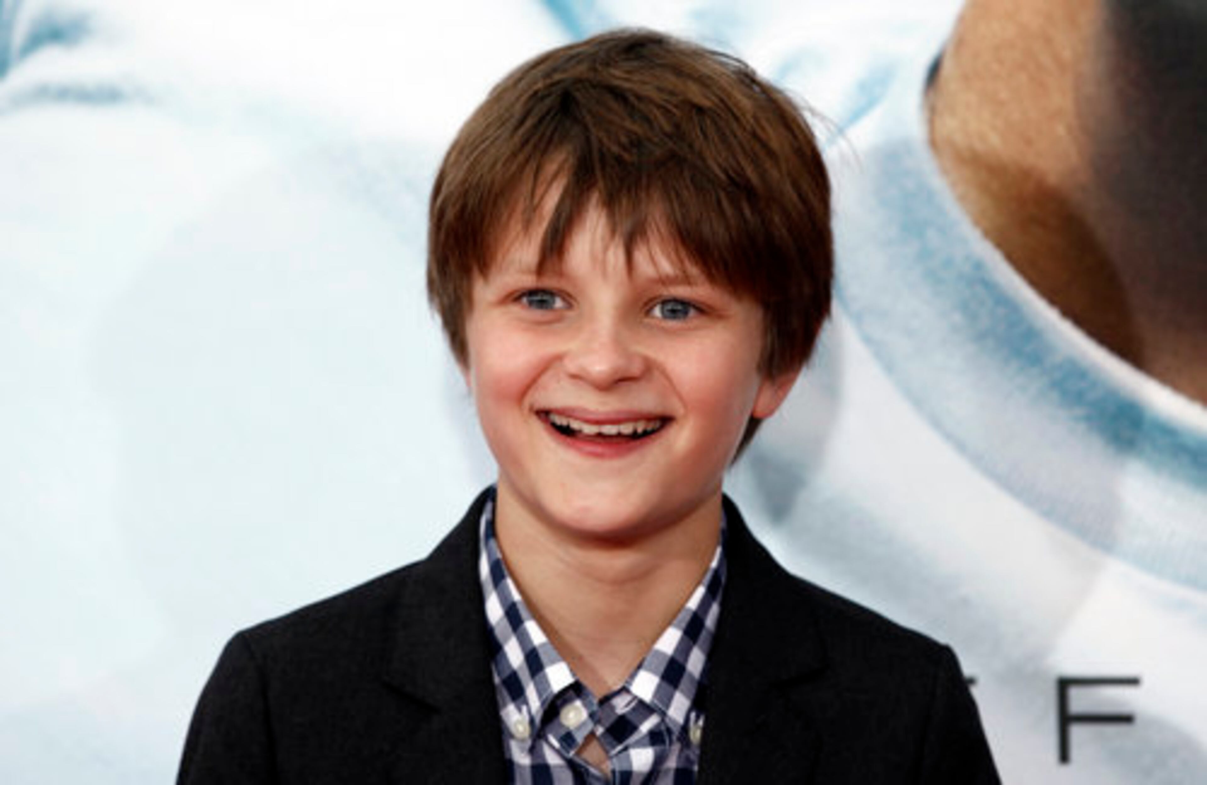 Cast member Charlie Tahan arrives.