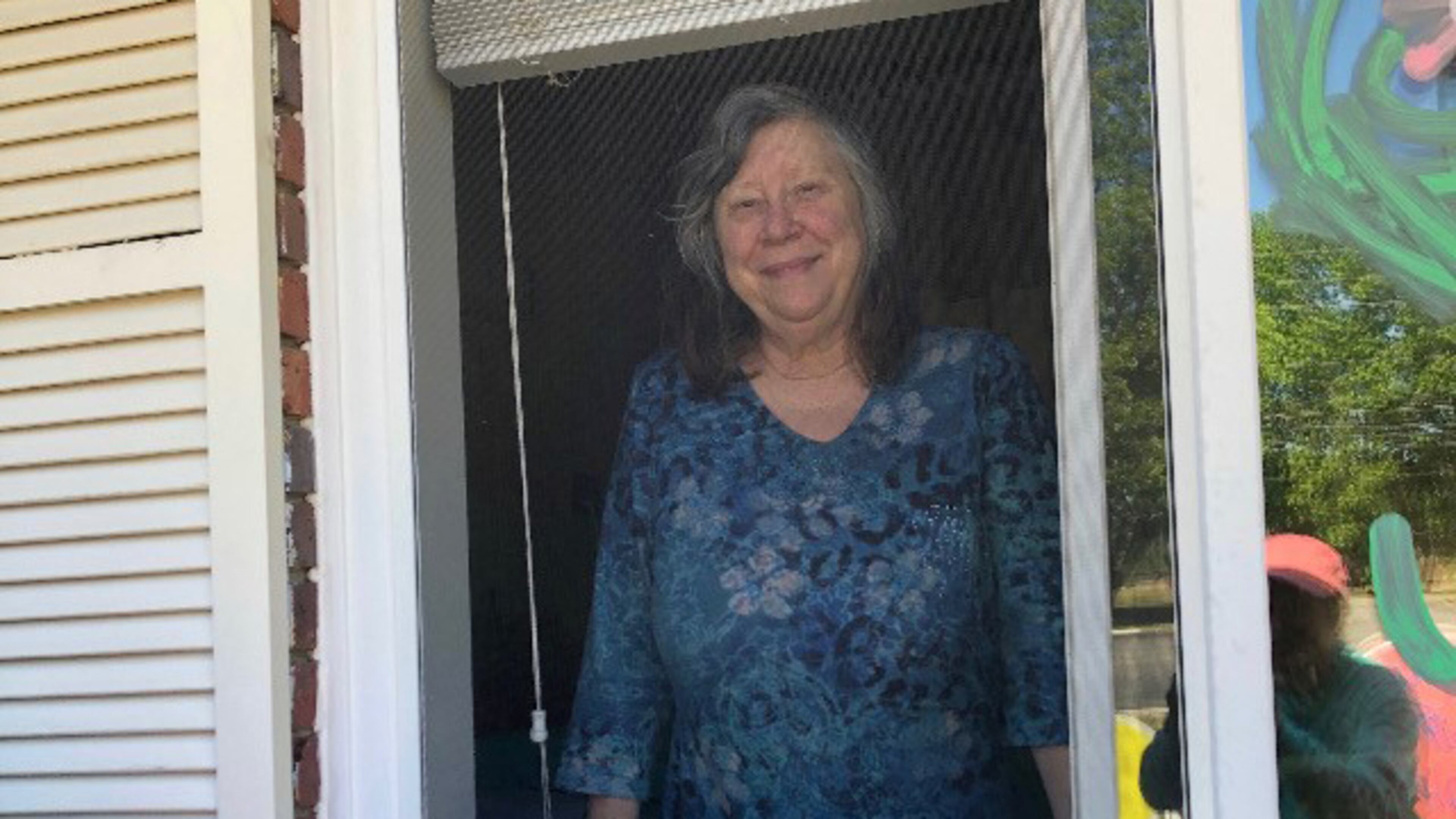 Marsha Tyson during a window visit with her family Mother's Day weekend at her nursing home in Dublin. Tyson has early-onset Alzheimer's and has forgotten her three children over the months of isolation and lockdown. (Pace Tyson / Family photo)
