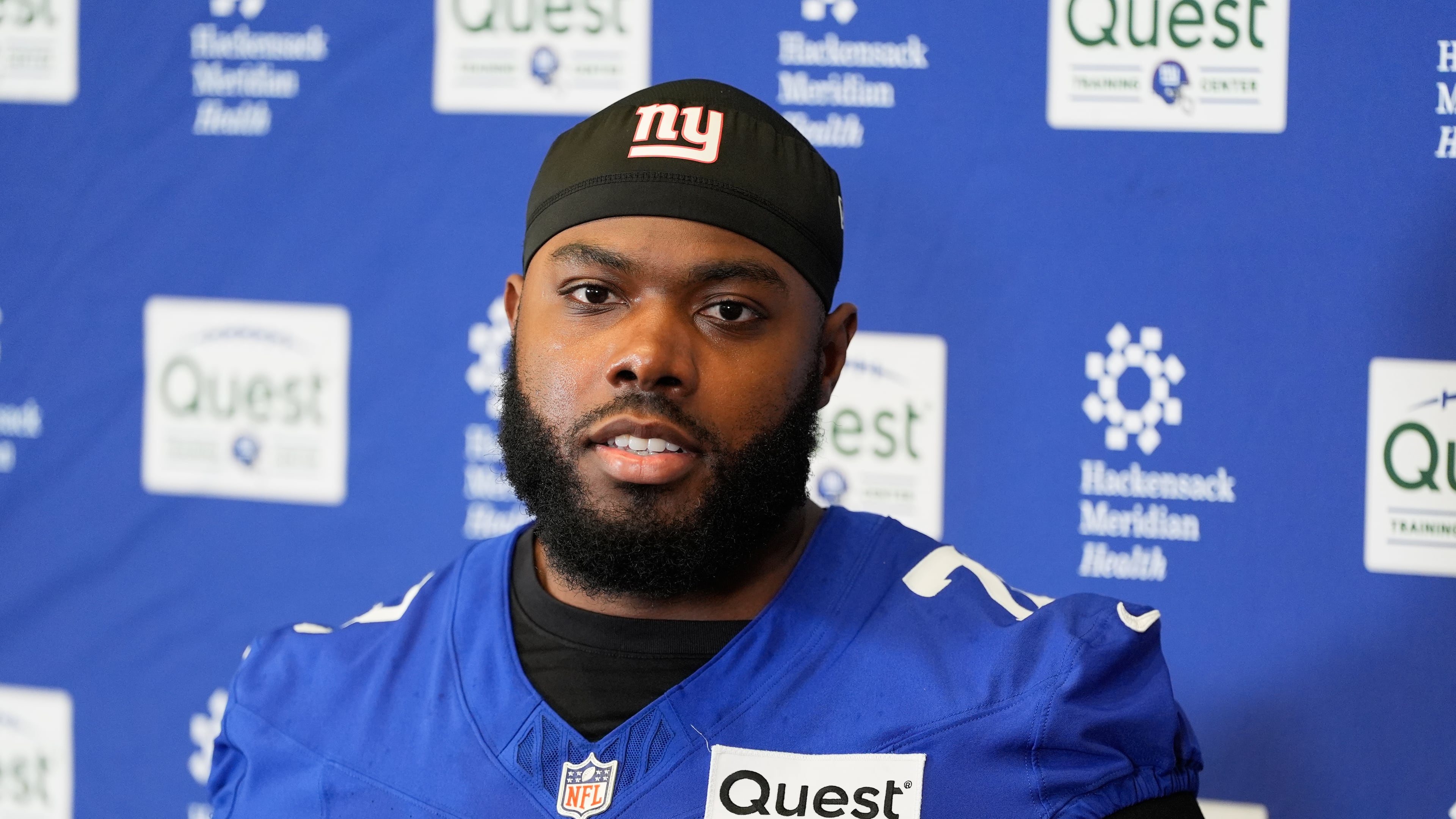 FILE - New York Giants' Andrew Thomas speaks to reporters after NFL football practice in East Rutherford, N.J., May 21, 2026. (AP Photo/Seth Wenig, file)