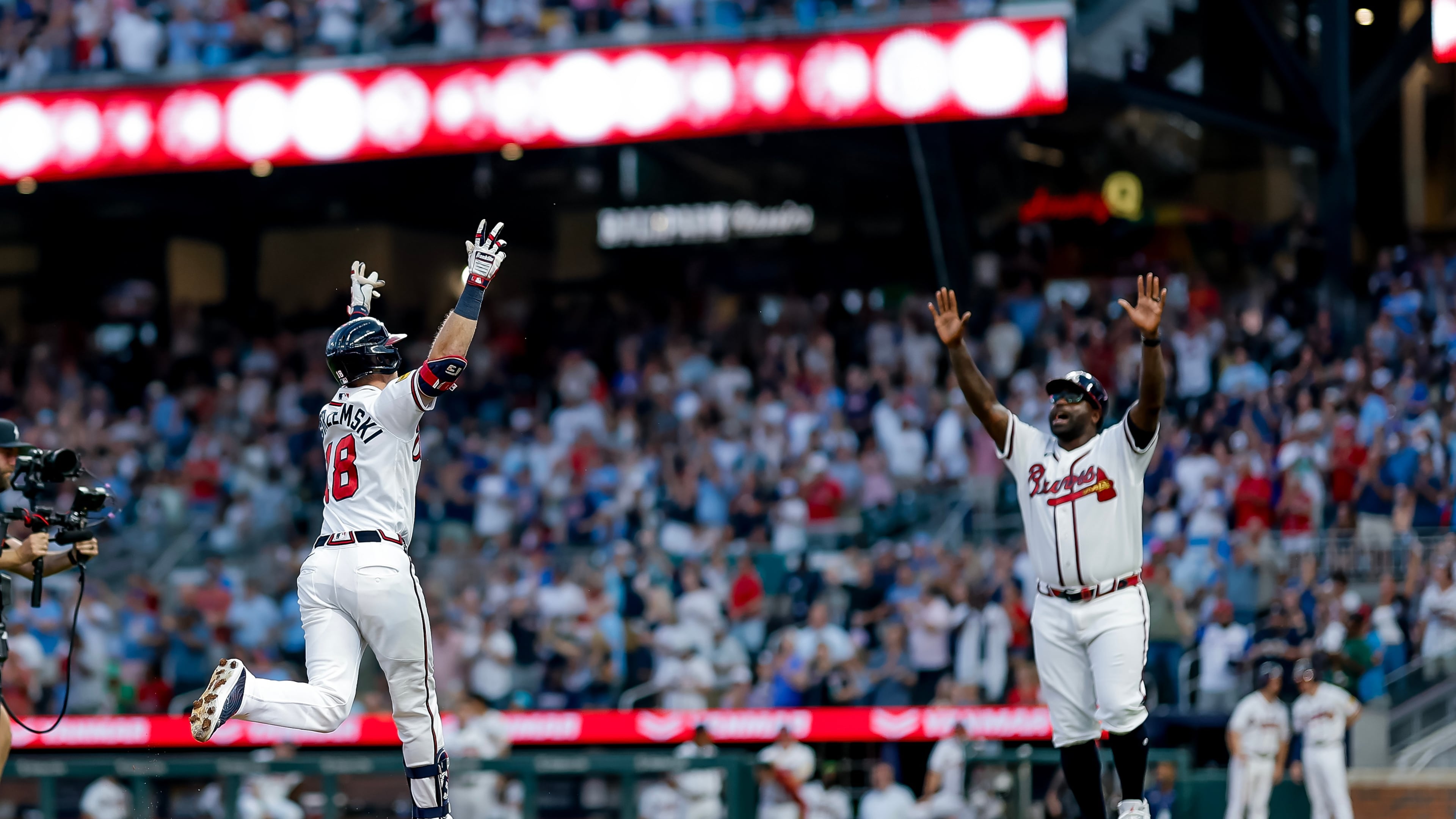 Atlanta Braves' Mike Yastrzemski (18) reacts with Braves third base coach Tommy Watkins (84) while rounding the bases after hitting a two-run home run against the Washington Nationals during the fifth inning of a baseball game, Thursday, July 30, 2026, in Atlanta. (AP Photo/Erik S. Lesser)