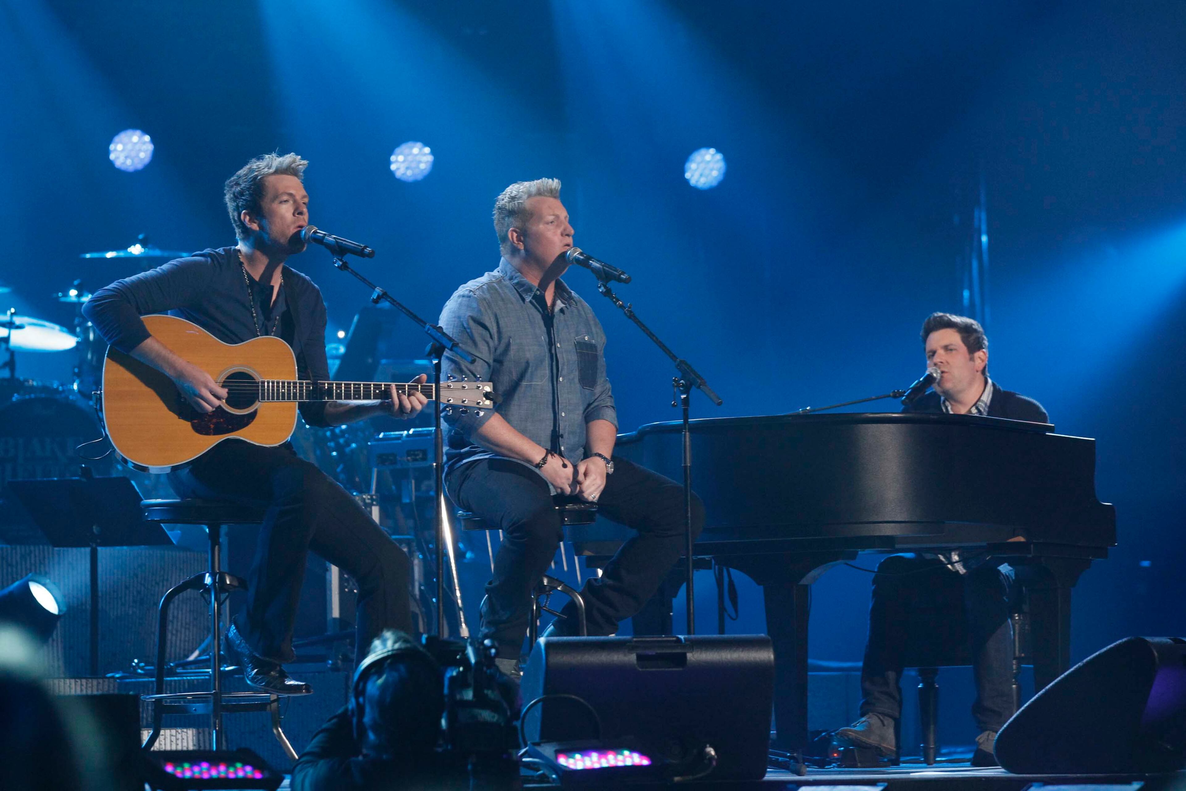 Members of Rascal Flatts, from left, Joe Don Rooney, Gary LeVox and Jay DeMarcus during the Healing in the Heartland: Relief Benefit Concert at the Chesapeake Energy Arena in Oklahoma City, Okla., Wednesday, May 29,2013. Funds raised by the benefit will go to the United Way of Central Oklahoma, for recovery efforts for those affected by the May 20 tornado. (AP Photo/NBC, Brett Deering)