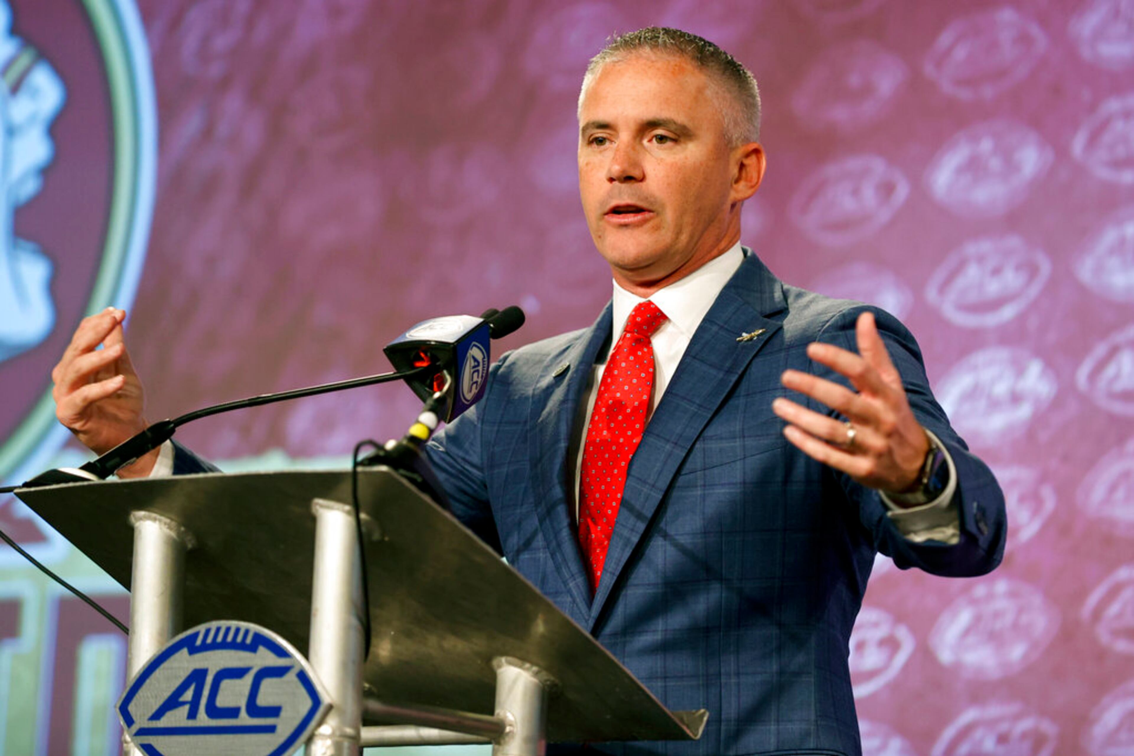Florida State head coach Mike Norvell answers a question at the NCAA college football Atlantic Coast Conference Media Days in Charlotte, N.C., Wednesday, July 20, 2022. (AP Photo/Nell Redmond)