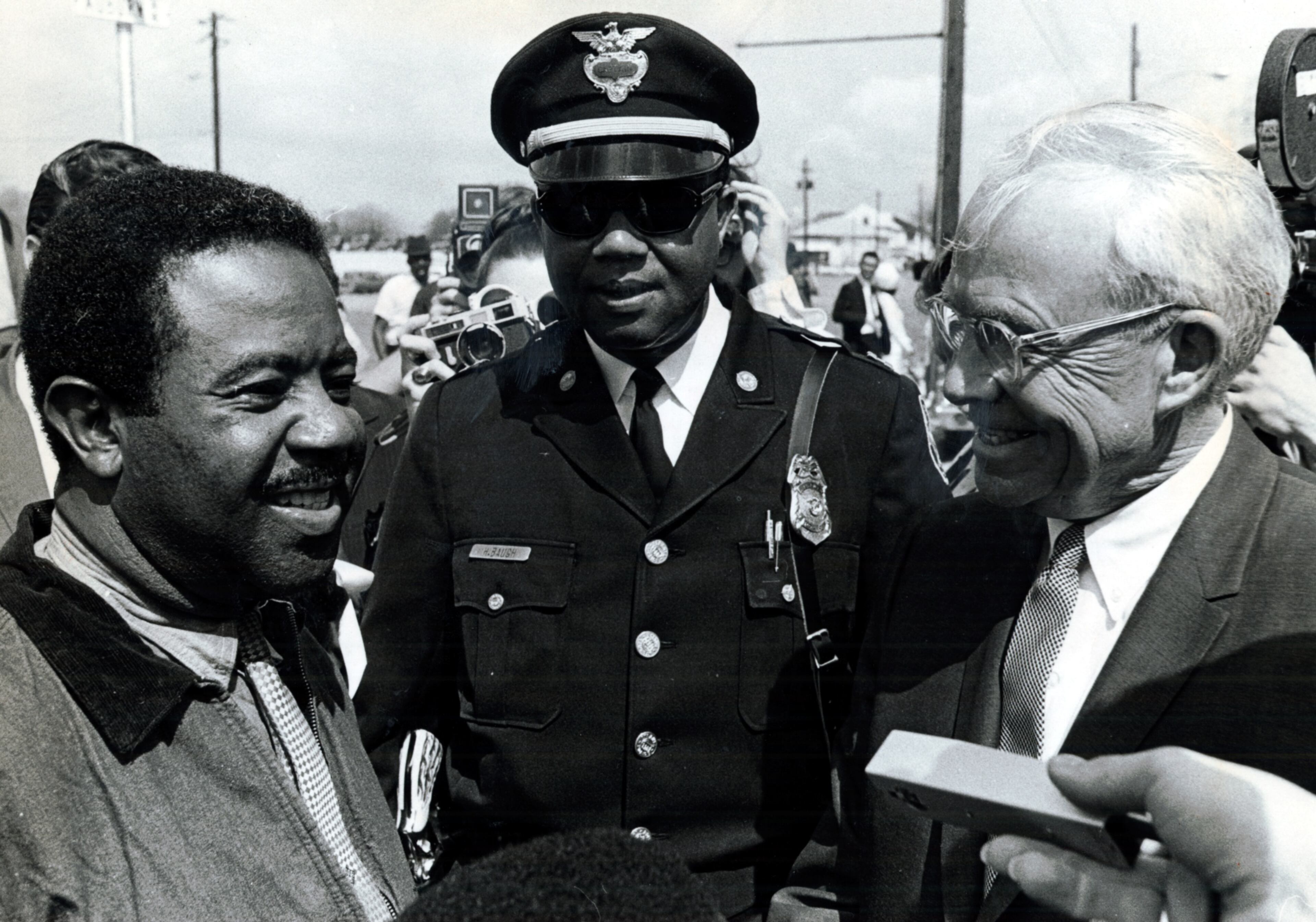 1969 -- Dr. Ralph David Abernathy, leader of the Southern Christian Leadership Conference, Atlanta Police Captain Howard Baugh and Mayor Ivan Allen engage in discussion during a demonstration.