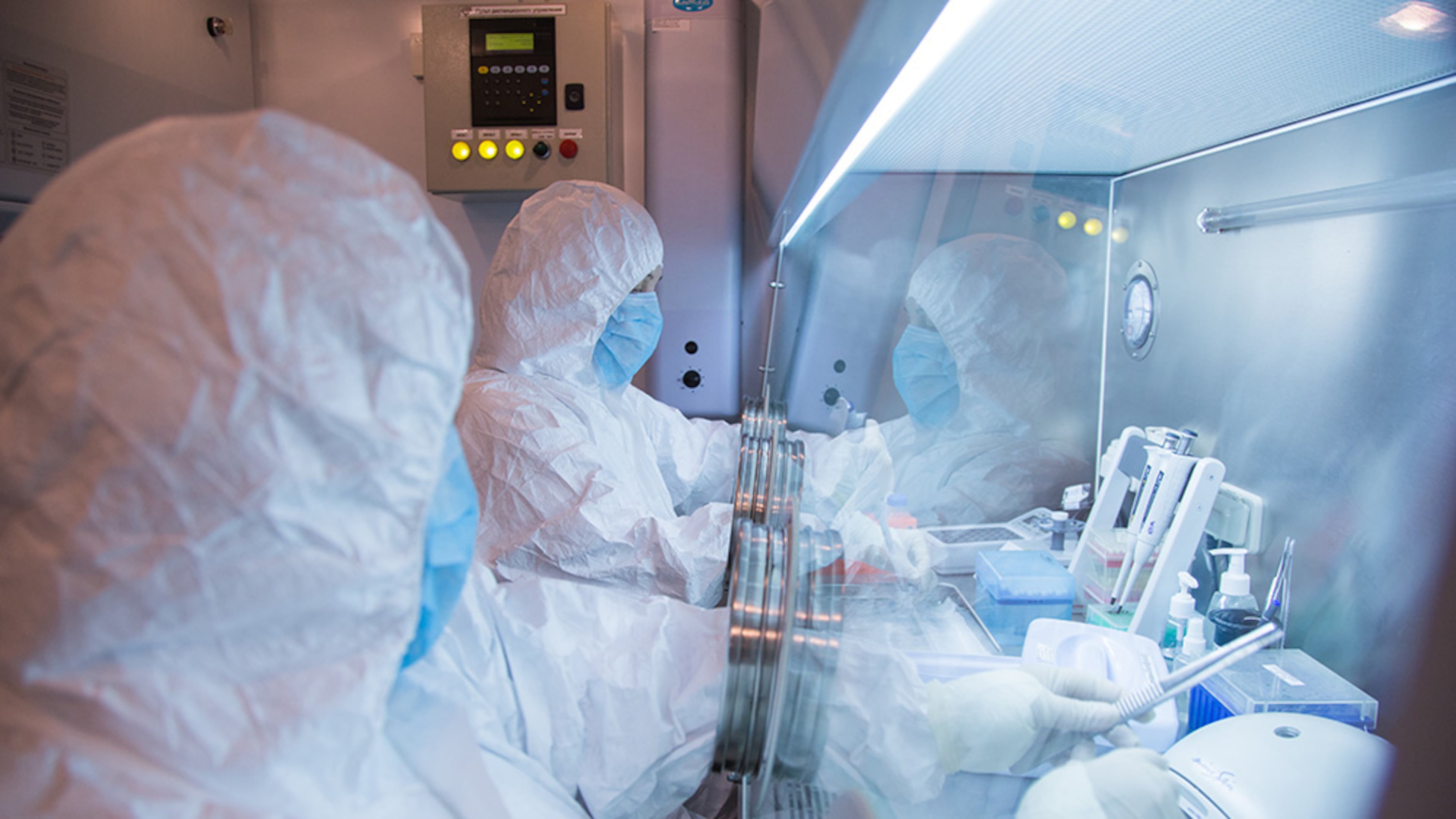 This undated photo released by the Irkutsk Anti-Plague Research Institute of Siberia and Far East, shows the institute workers in a lab. (The Irkutsk Anti-Plague Research Institute of Siberia and Far East via AP)