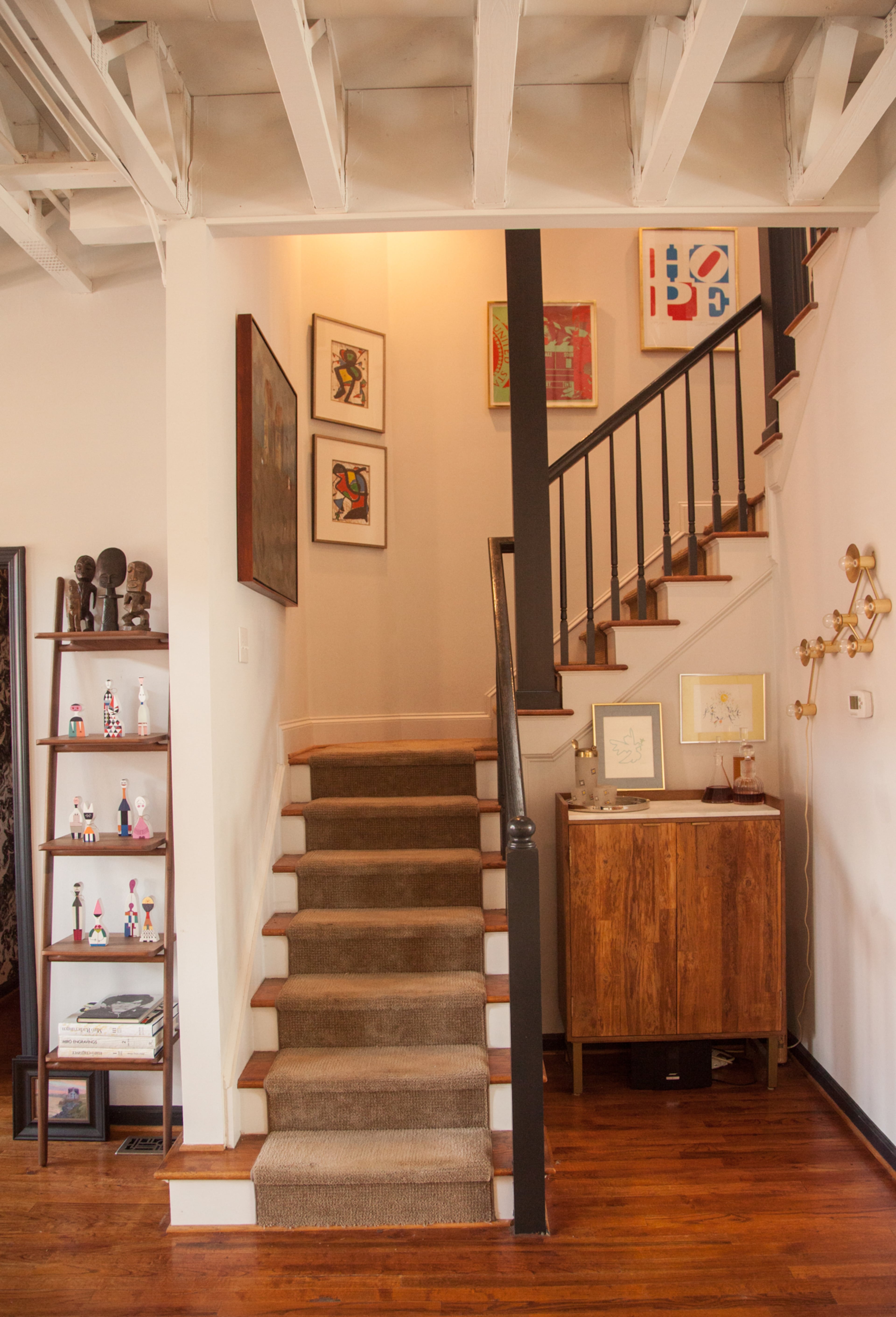 The four-story townhome is filled with modern artwork and mid-century furniture. "We wanted to be contemporary, but at the same time, comfortable for our friends and guests coming over," Mark Curran said.