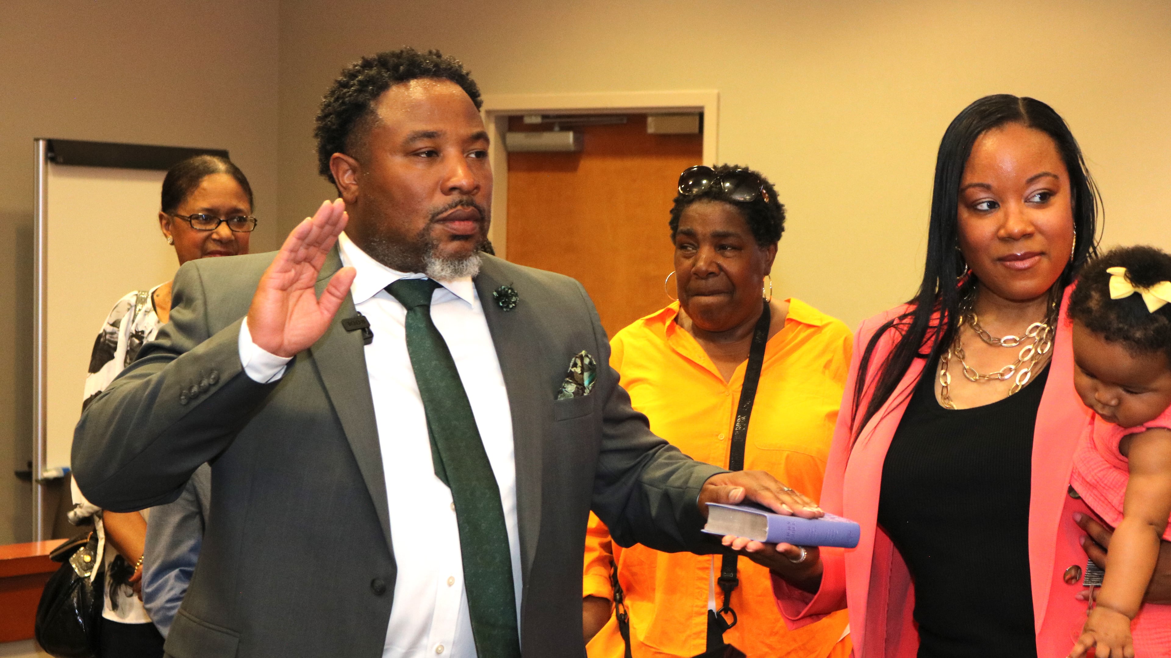 Devon Horton takes the oath of office at the DeKalb County Superior Courthouse in Decatur on Thursday, June 29, 2023. Members of his family, including his wife Christiane Horton, were in attendance at the private ceremony. Horton begins working as the superintendent of the DeKalb County School District on July 1. (Photo courtesy DeKalb County School District)