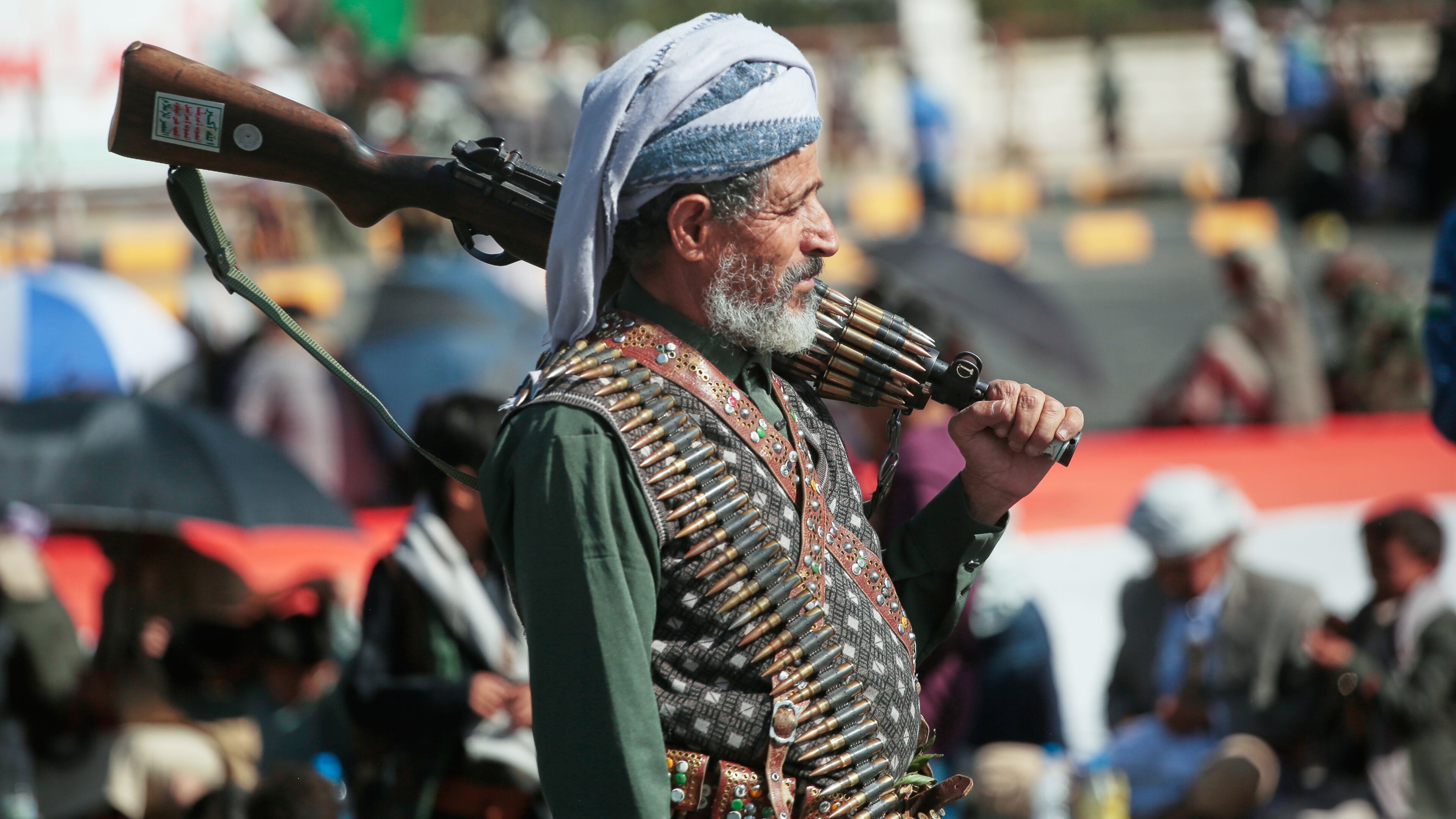 A supporter of Yemen's Houthi rebels carries his rifle during a rally in support of the group, in Sanaa, Yemen, Friday, Oct. 9, 2026. (AP Photo/Osamah Abdulrahman)