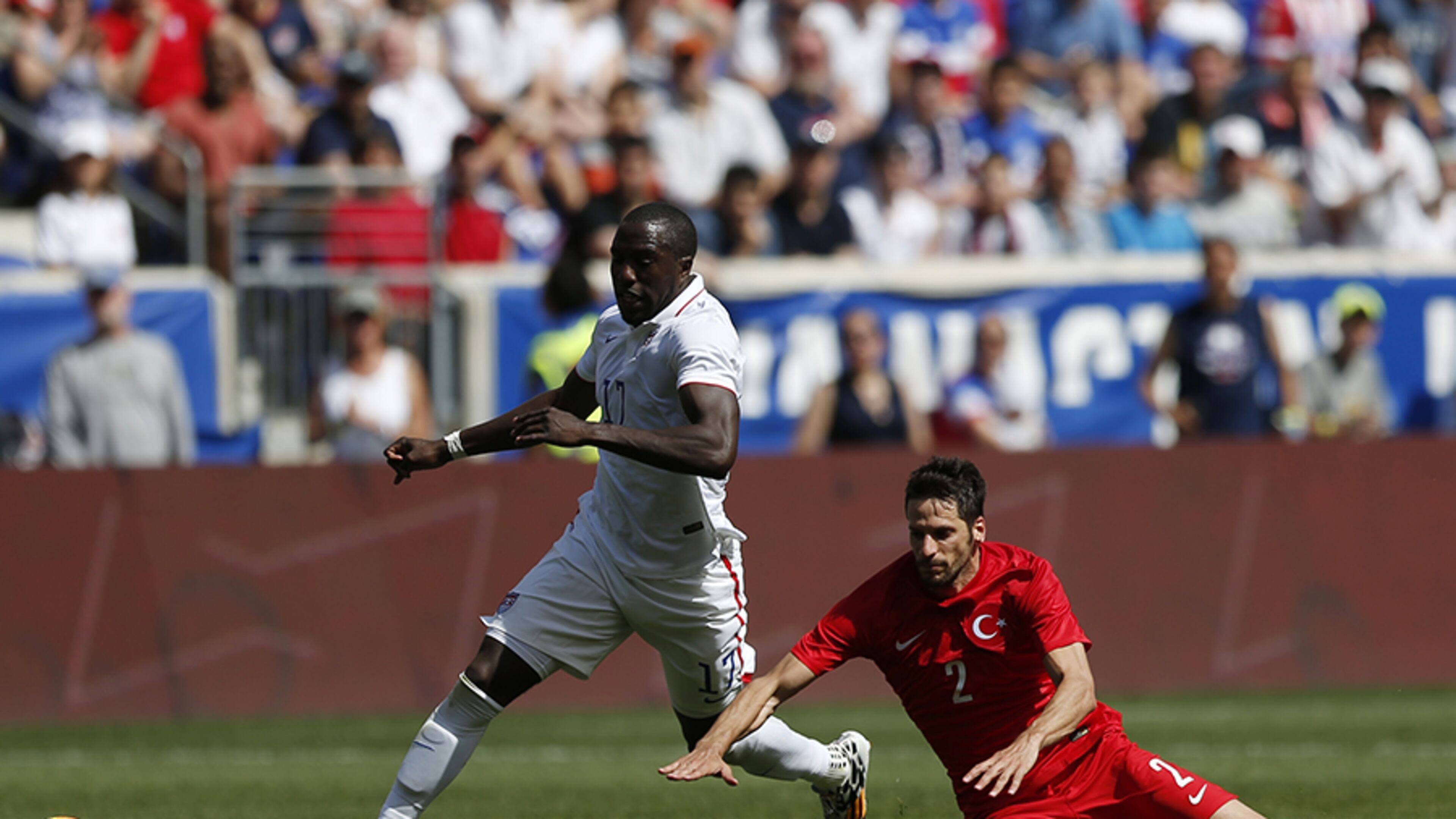 United States' Jozy Altidore (left) runs by Turkey's Hakan Kadir Balta in the second half of an international soccer friendly, Sunday, June 1, 2014, in Harrison, N.J. The U.S. won 2-1.