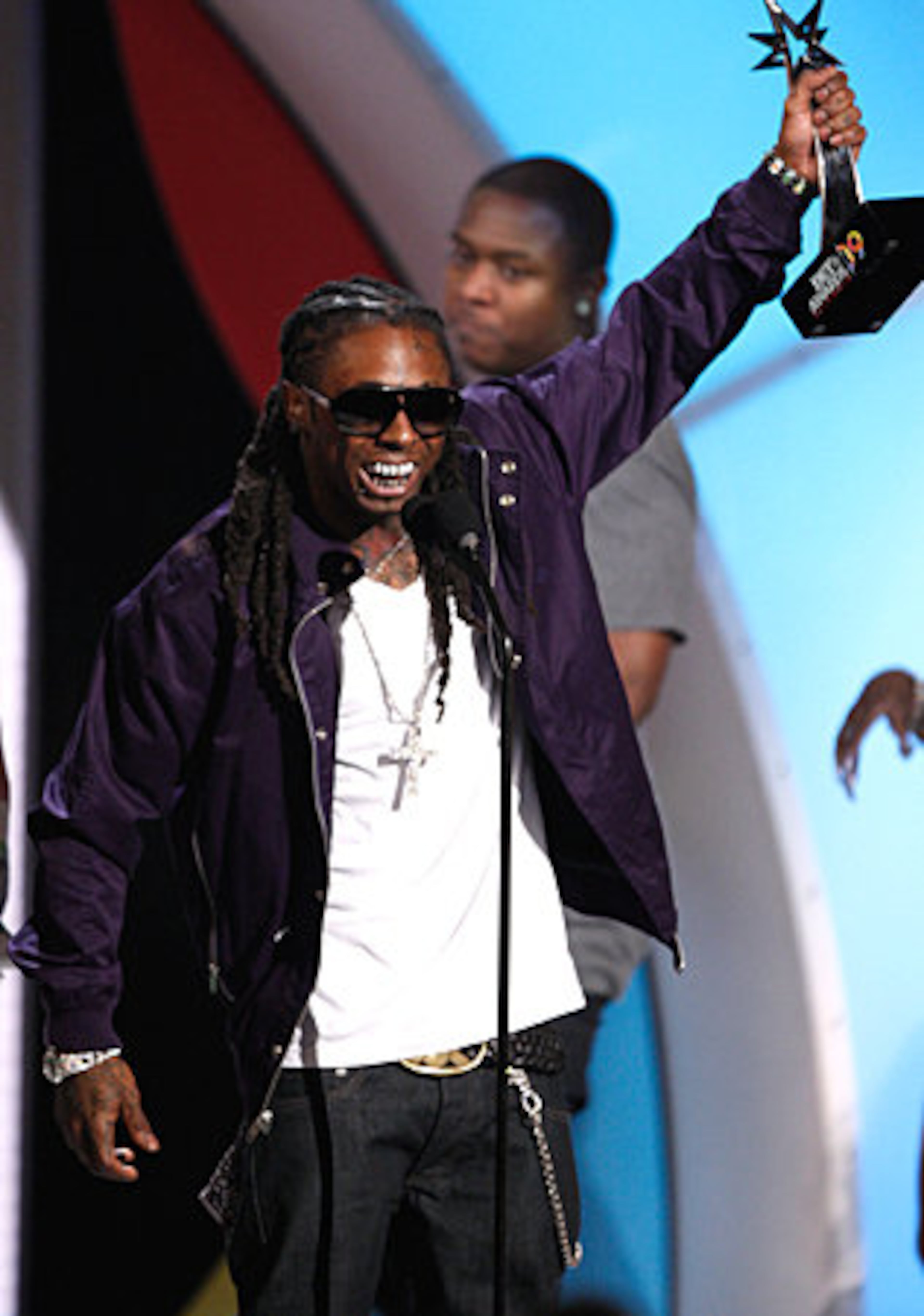 Rapper Lil' Wayne accepts the Best Male Hip-Hop Artist award.