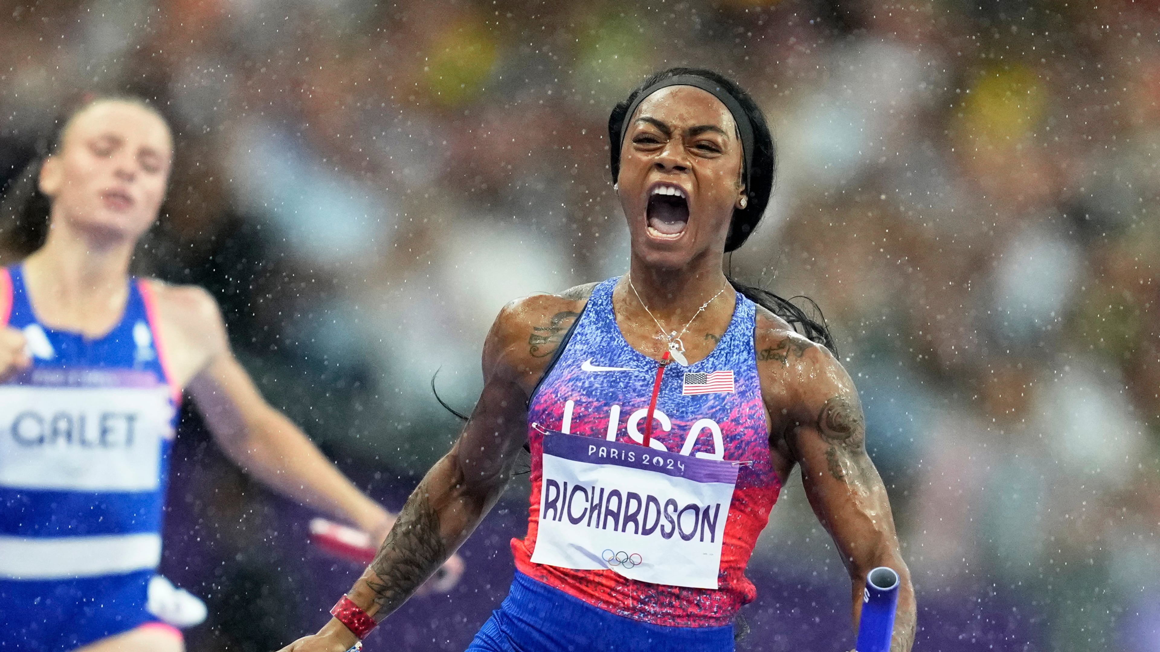 FILE - Sha'carri Richardson, of the United States, crosses the finish line to win the gold medal in the women's 4 x 100 meters relay final at the 2024 Summer Olympics on Aug. 9, 2024, in Saint-Denis, France. (AP Photo/Ashley Landis, File)