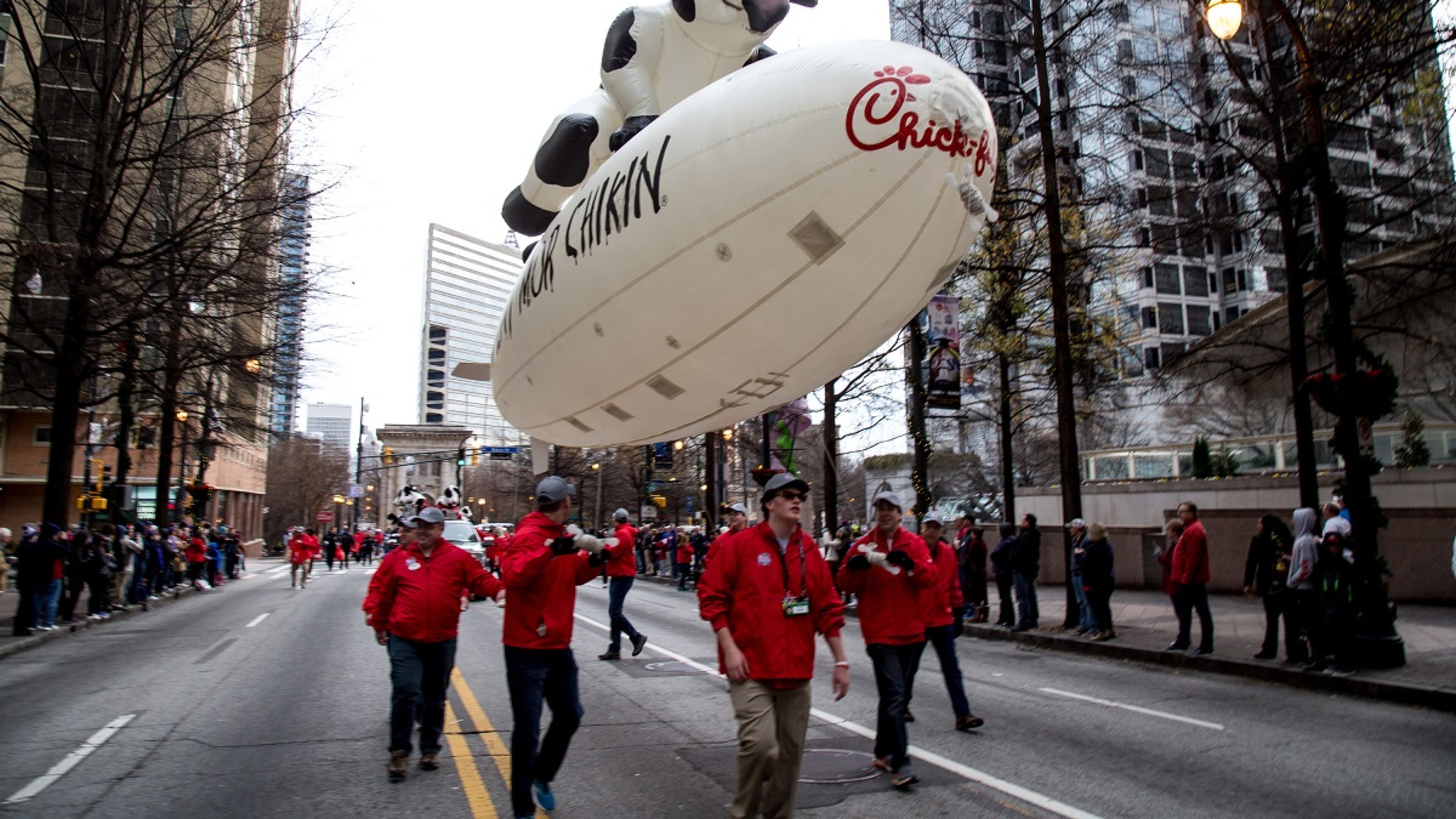 The Chick-fil-A float heads down Peachtree Street during the Chick-fil-A Peach Bowl parade Saturday, December 31, 2016, in Atlanta Ga. STEVE SCHAEFER / SPECIAL TO THE AJC