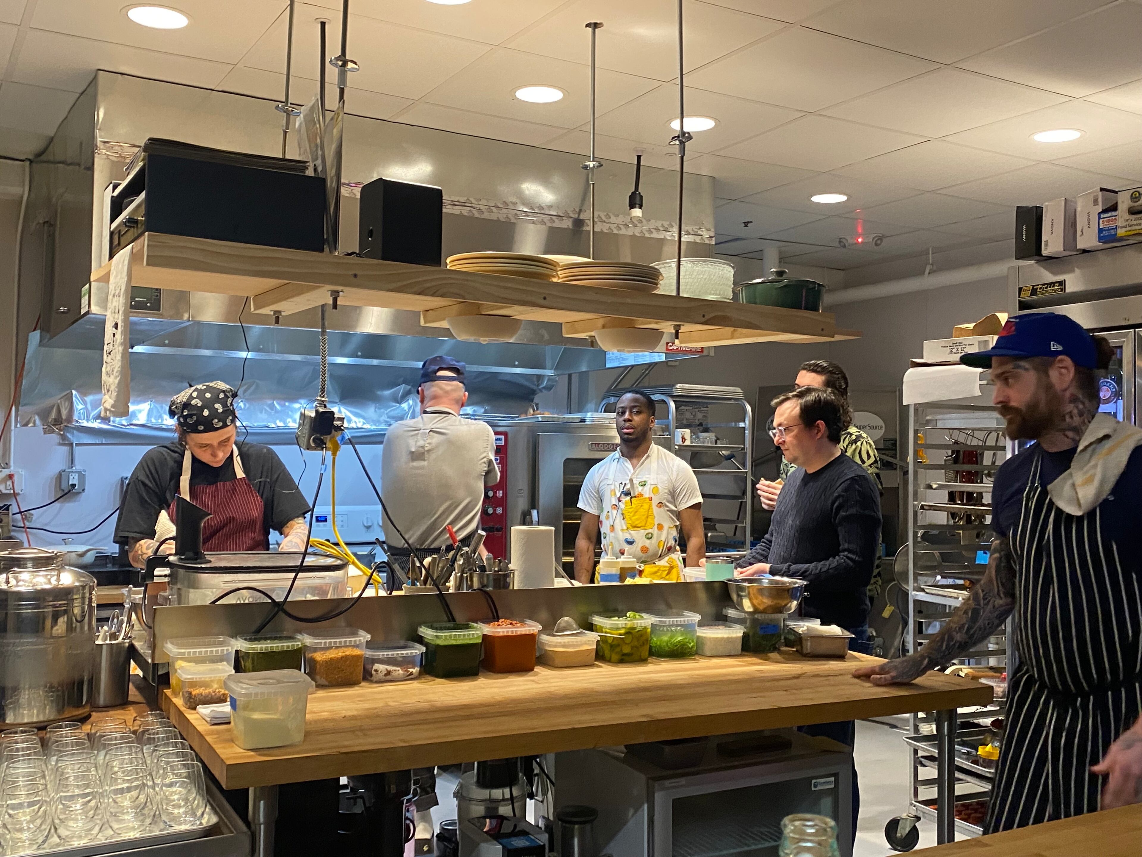Counter seating gives guests at Bovino After Dark a closeup view of the kitchen and frequent interaction with its staff. (Ligaya Figueras/AJC)