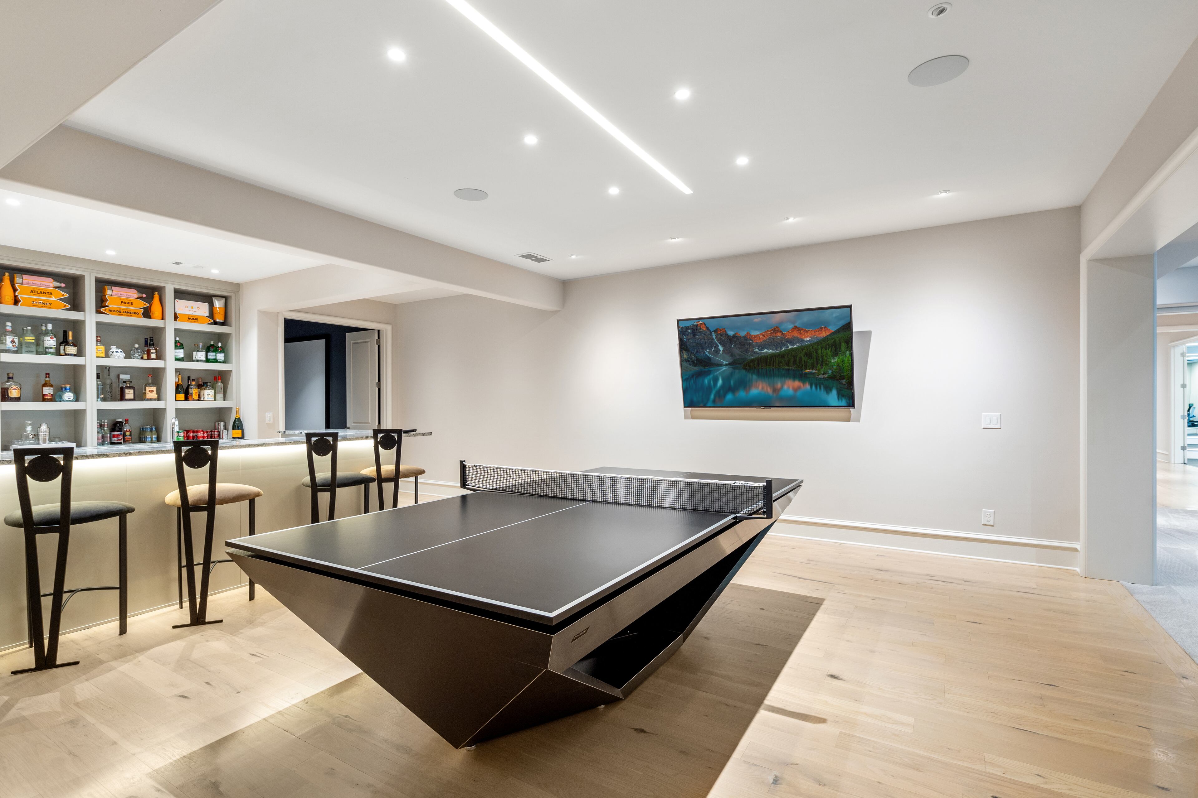 A billiards table in the basement entertainment space.