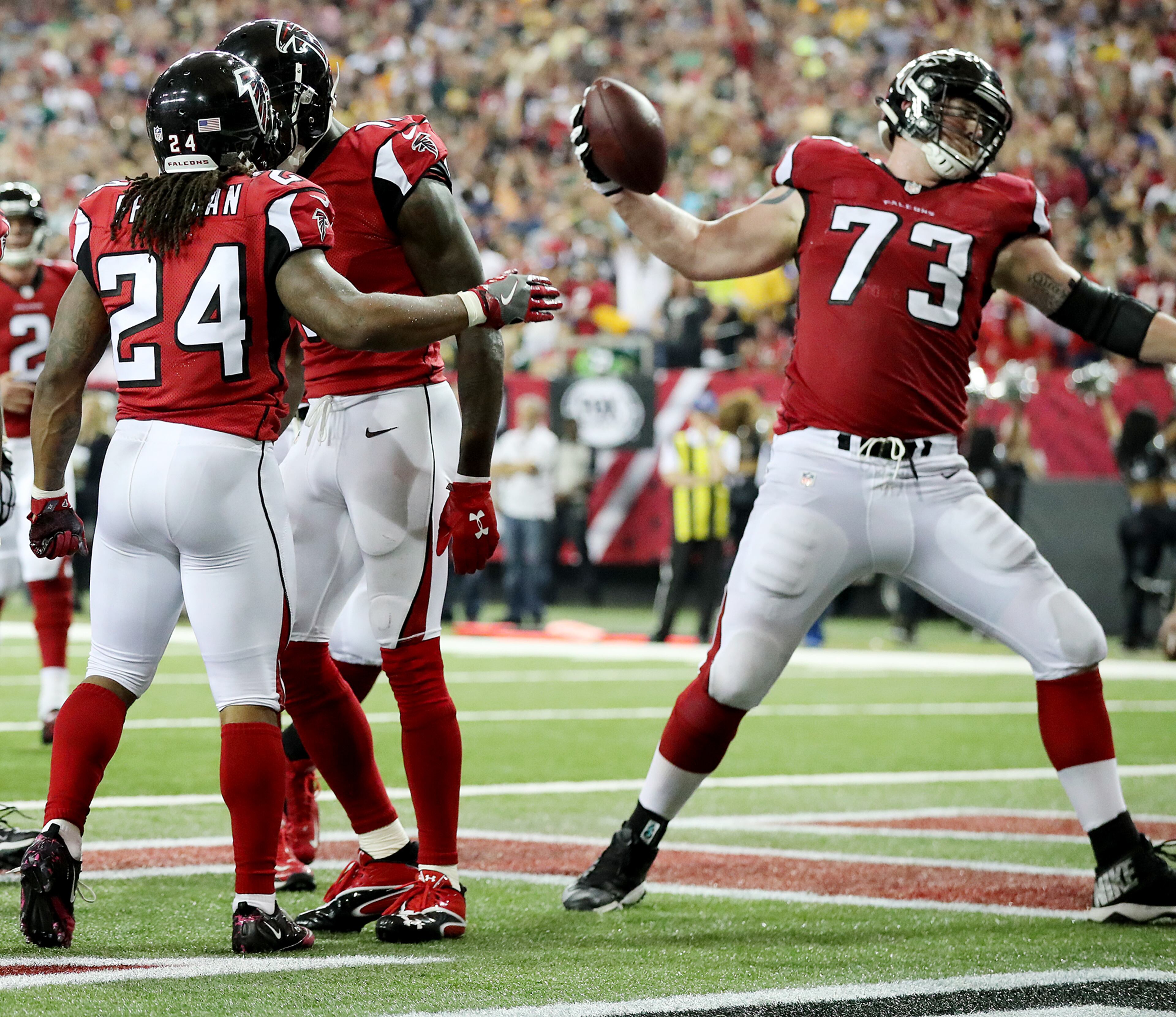 October 30, 2016 ATLANTA: Falcons running back Devonta Freeman hands off the ball to offensive lineman Ryan Schraeder to spike after he scores a touchdown against the Packers in an NFL football game on Sunday, Oct. 30, 2016, in Atlanta. Curtis Compton /ccompton@ajc.com