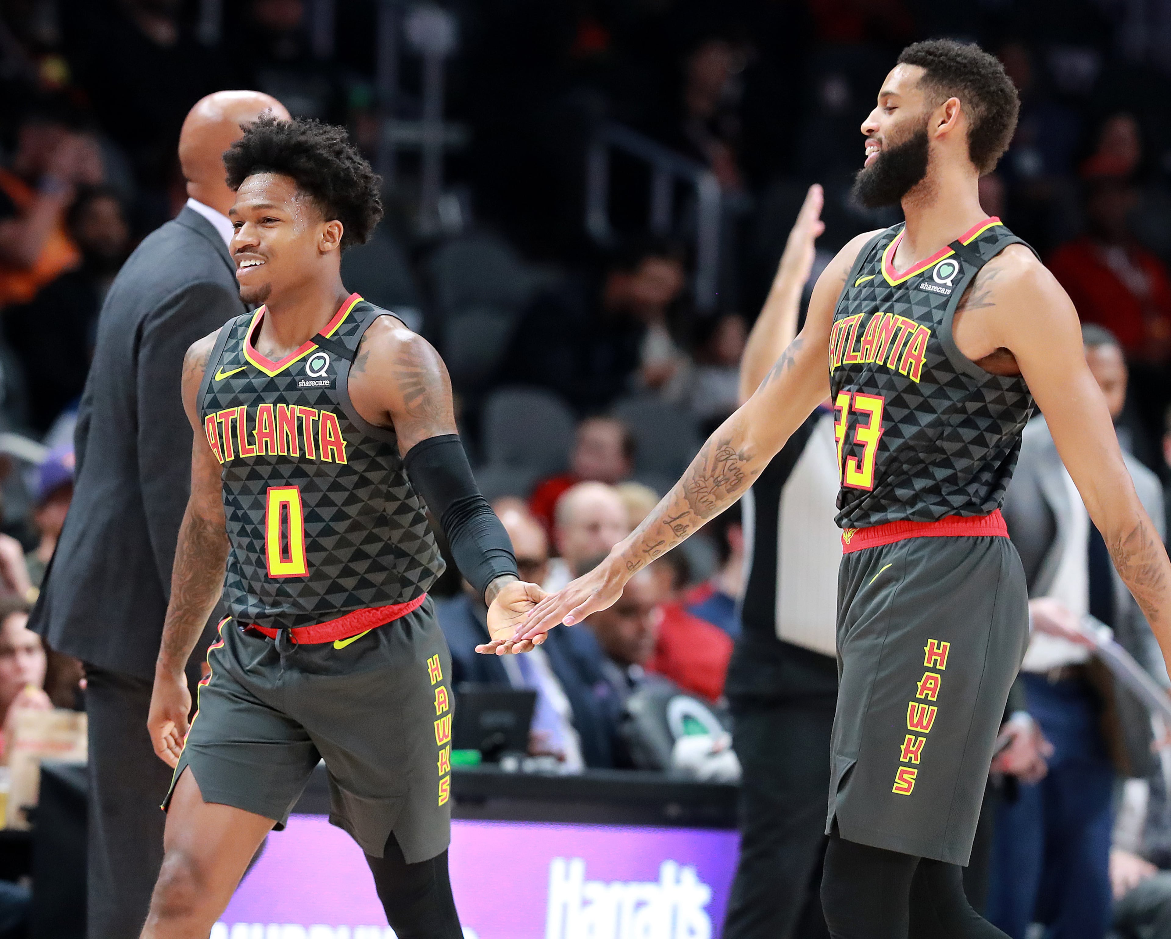 Hawks guard Brandon Goodwin (left) gets five from Allen Crabbe after hitting a long 3-pointer at the buzzer during the end of the first period against the Phoenix Suns in a NBA basketball game on Tuesday, January 14, 2020, in Atlanta. Curtis Compton ccompton@ajc.com