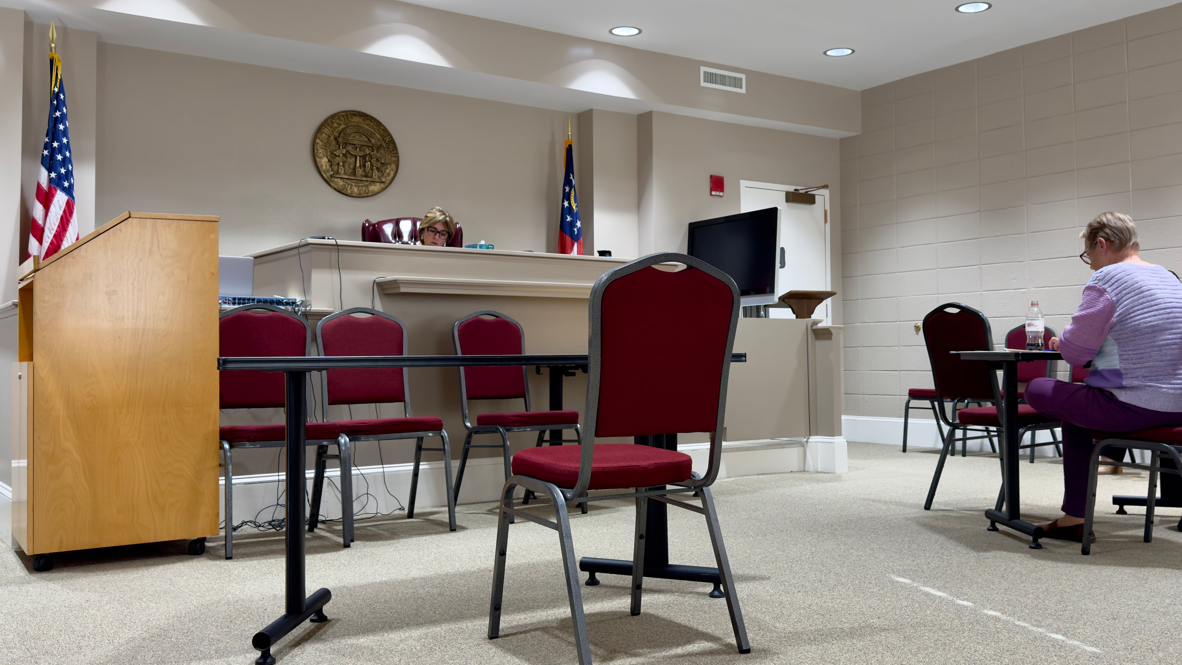 In a small, secondary courtroom, Peach County Superior Court Judge Connie L. Williford, left, met one by one with locals who'd been called for jury duty in November -- but never showed up -- to explain their absences. (Joe Kovac Jr. / AJC)