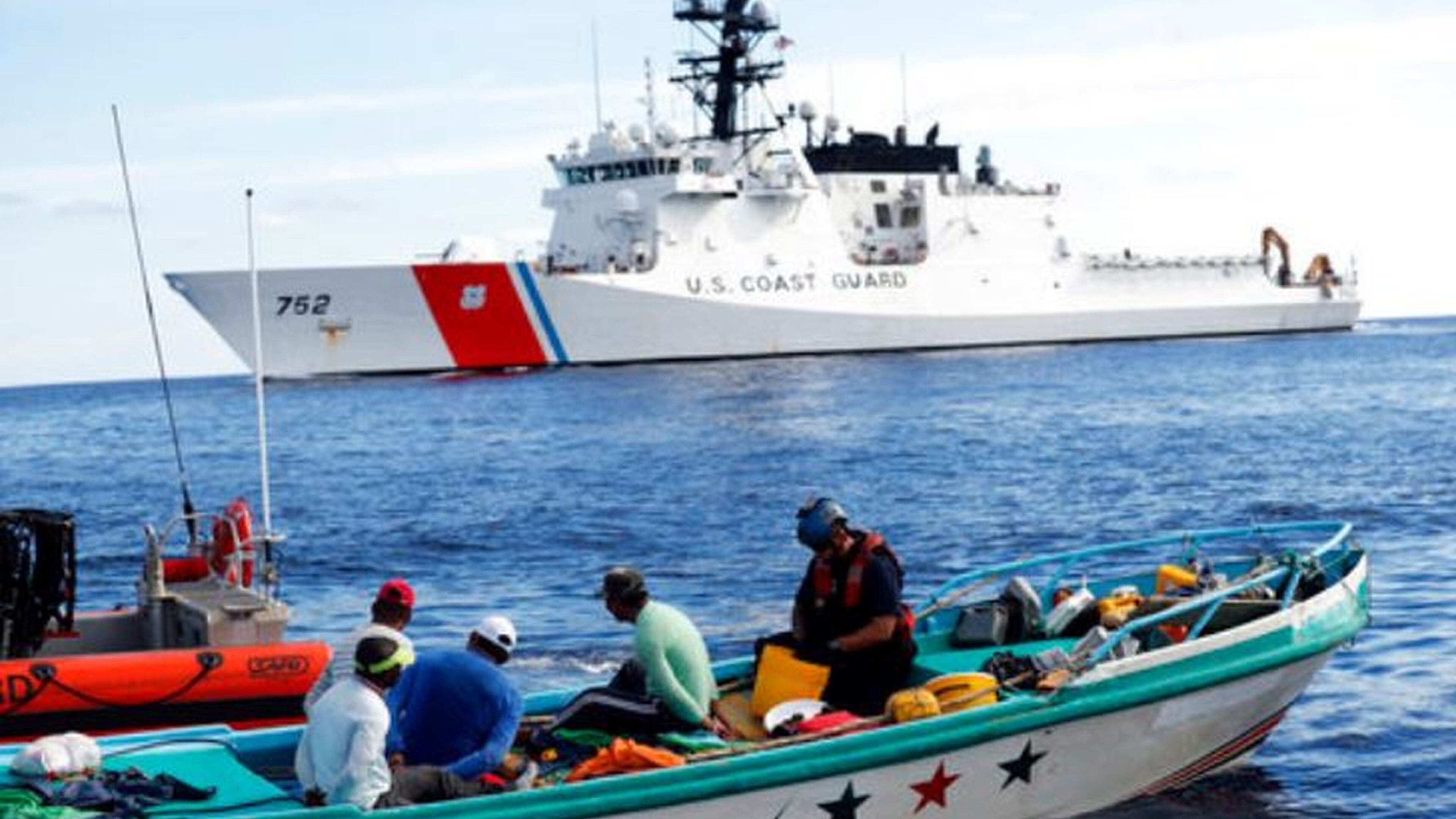 A U.S. Coast Guard law enforcement team boards a small fishing boat that was stopped carrying close to 700 kilos of pure cocaine, in the Pacific Ocean hundreds of miles south of the Guatemala-El Salvador border om February 2017. (AP Photo/Dario Lopez-Mills)