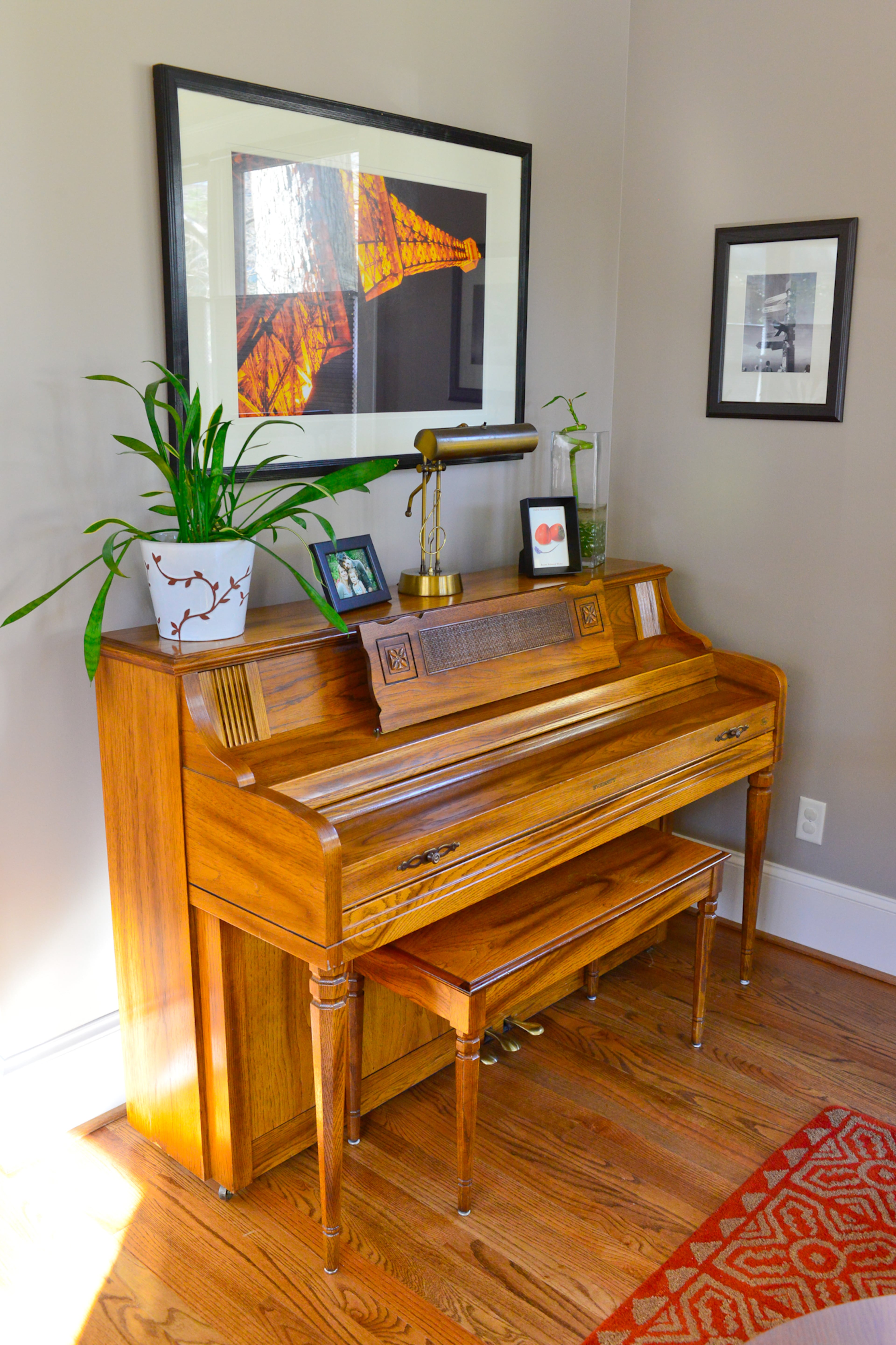 Homeowner Peter Olson's parents bought the piano in the 1980s, when Peter was learning to play. Olson and his wife Alyssa added a wall in their Atlanta living room, creating an ideal backdrop for the piano and a photograph of the faux Eiffel Tower, which Peter actually took at the Paris Las Vegas Hotel & Casino.