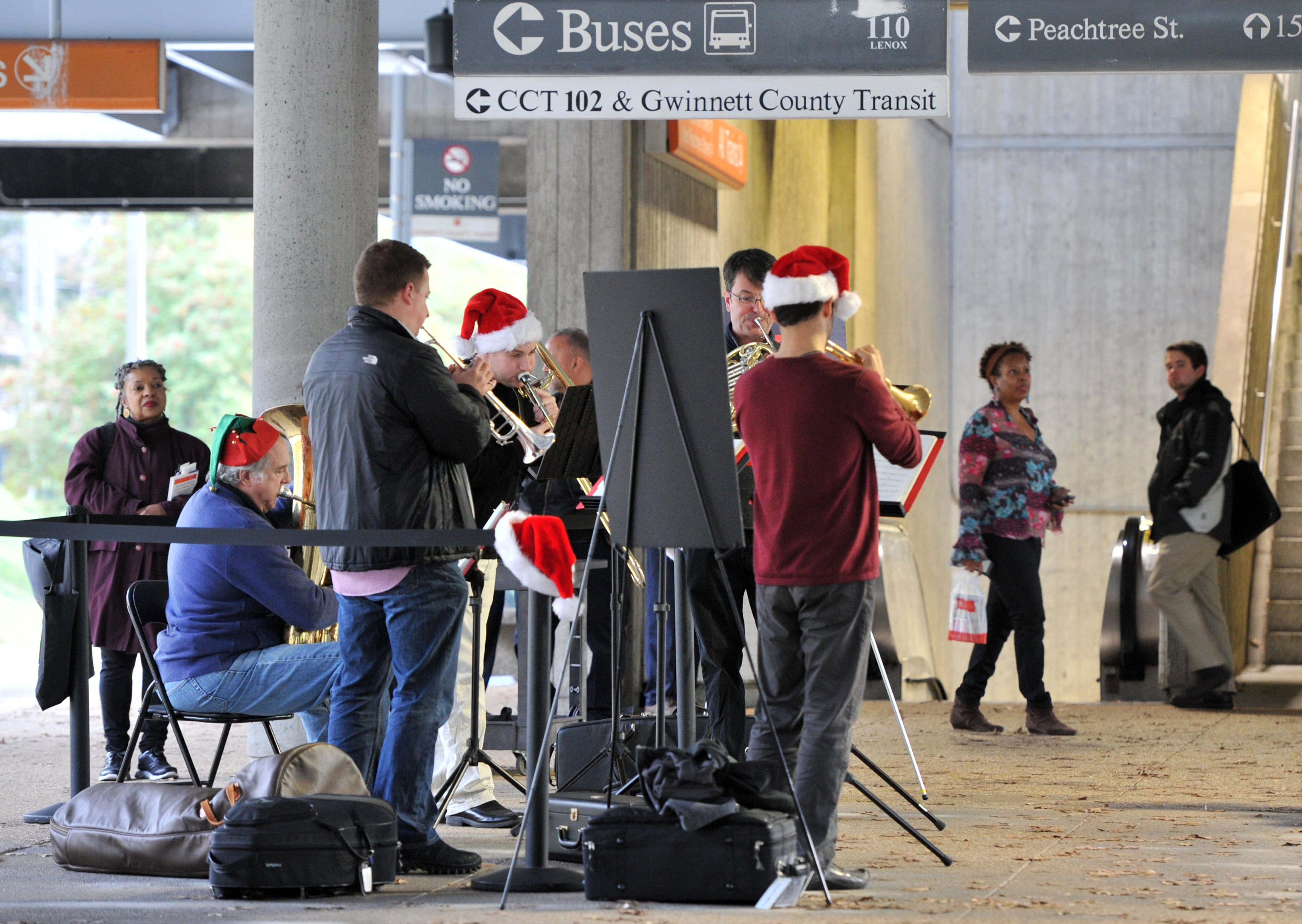 The Atlanta Symphony Orchestra Brass Quintet performs during their free pop-up concert, which is a part of the ASO's Midtown Takeover series, at MARTA Arts Center Station on Friday, Dec. 20, 2013.