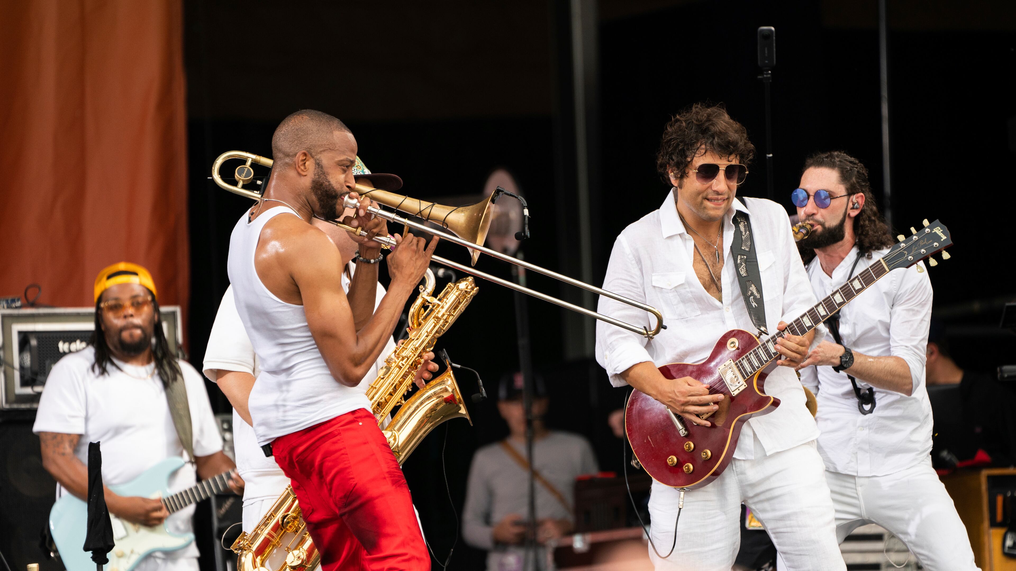 Trombone Shorty, left, and Pete Murano of Trombone Shorty & Orleans Avenue perform at the 2023 New Orleans Jazz & Heritage Festival on Sunday, May 7, 2023, at the Fair Grounds Race Course in New Orleans. (Photo by Amy Harris/Invision/AP)