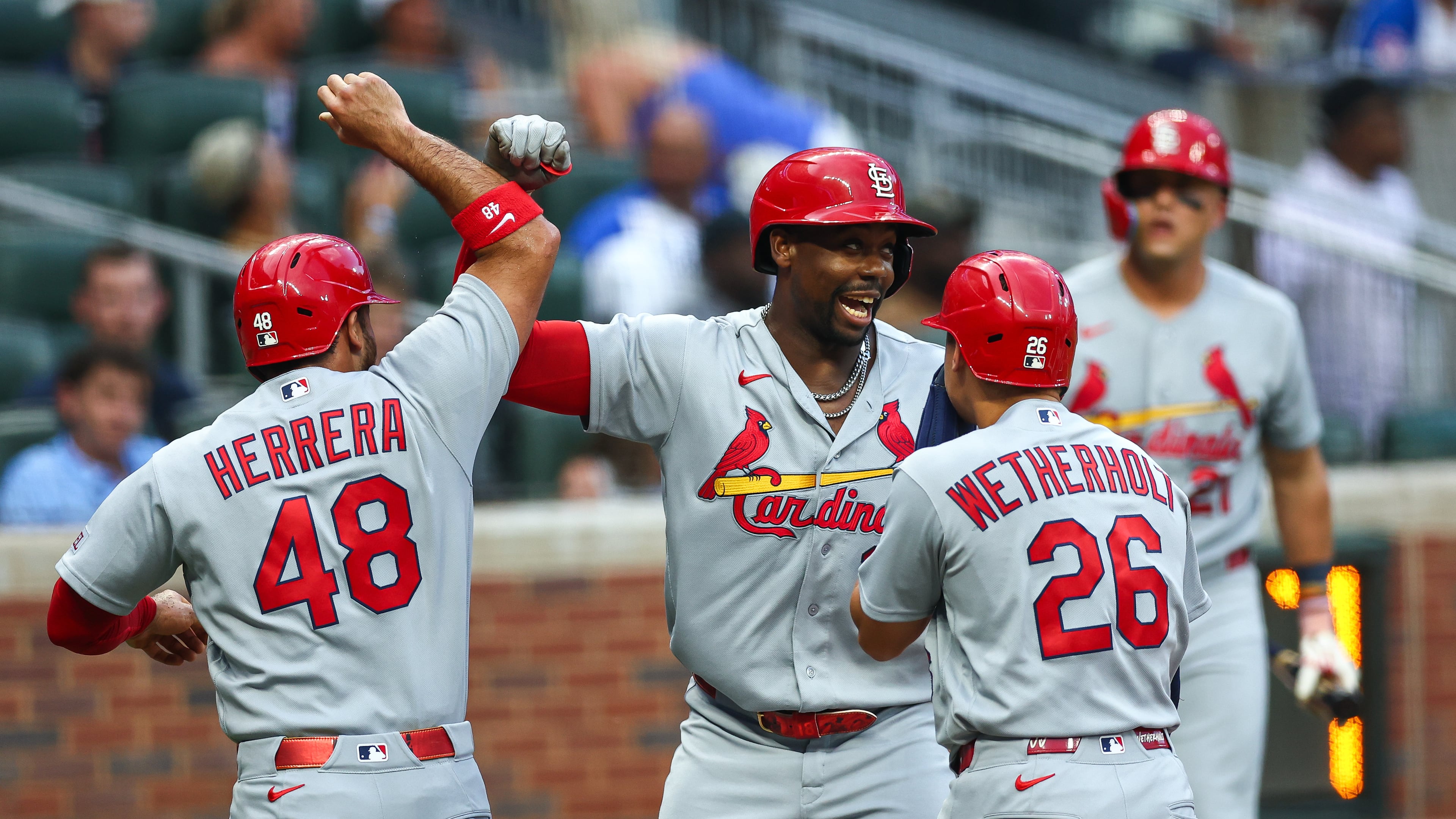 St. Louis Cardinals' Jordan Walker, center, reacts with Iván Herrera (48) and JJ Wetherholt (26) after hitting a three-run home run in the first inning of a baseball game against the Atlanta Braves, Thursday, July 2, 2026, in Atlanta. (AP Photo/Colin Hubbard)