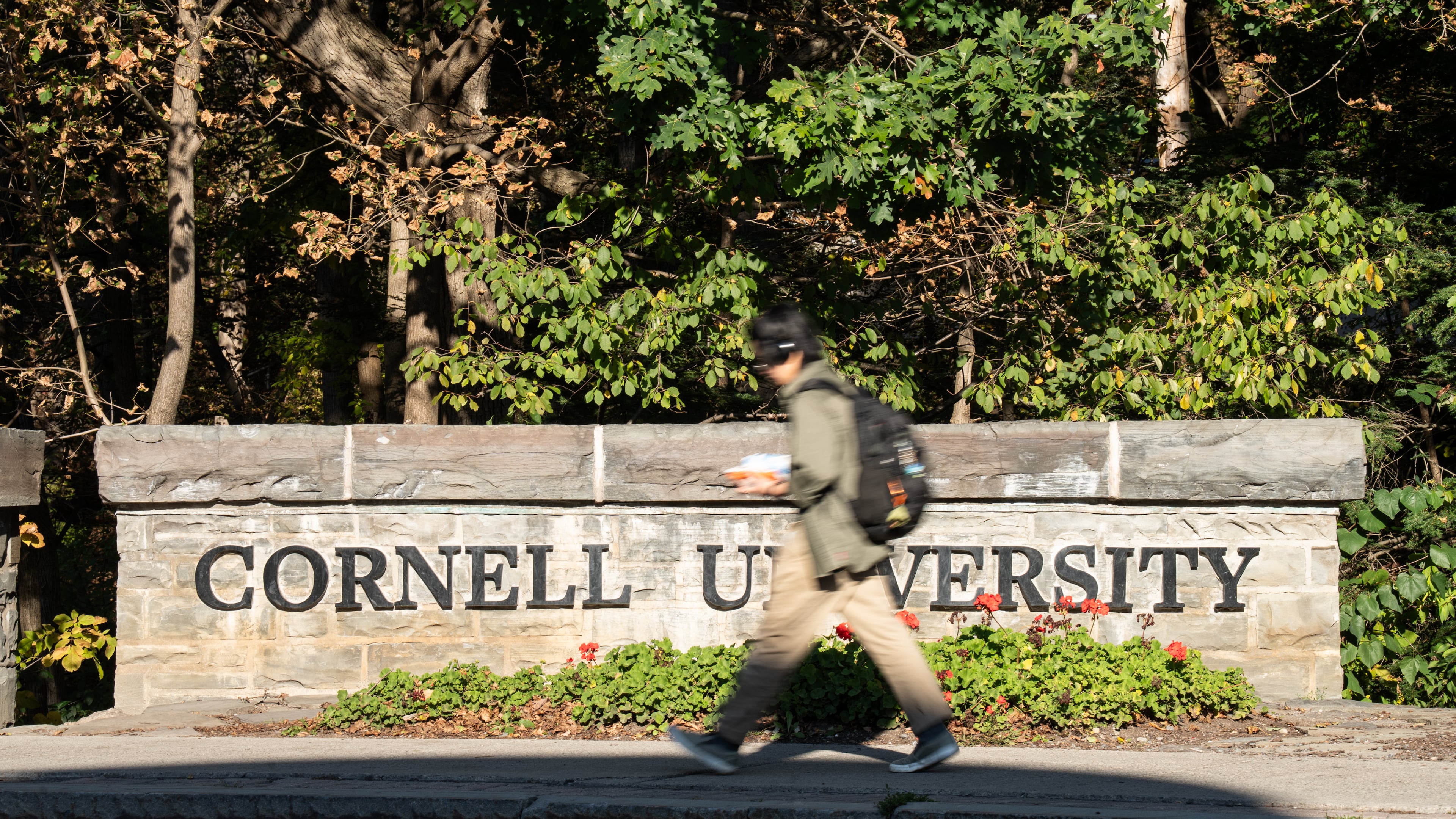 Students walk through Cornell University's campus, Wednesday, Oct. 7, 2026, in Ithaca, N.Y. (AP Photo/Matt Burkhartt)