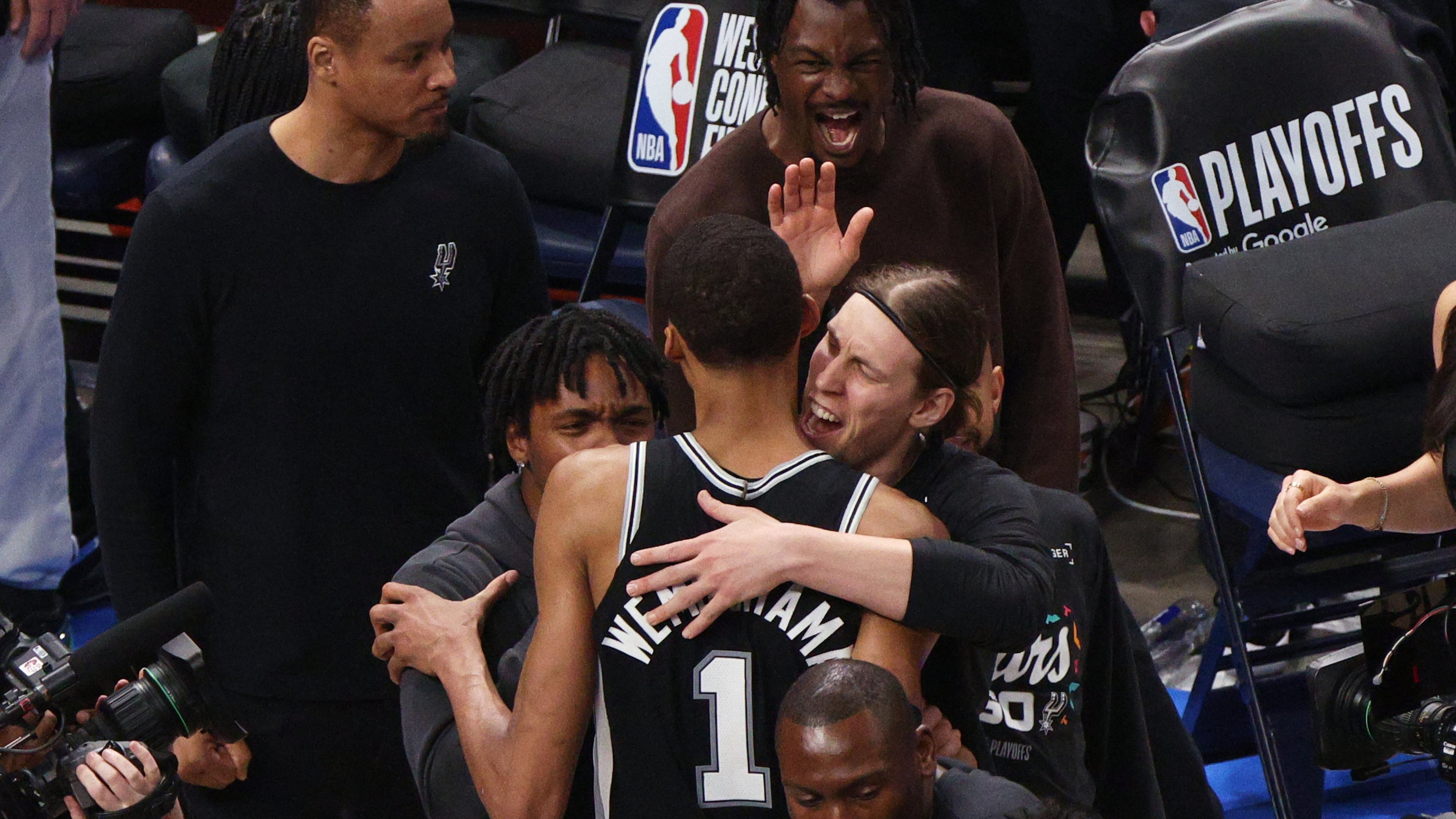 San Antonio Spurs forward Victor Wembanyama (1) celebrates with teammates after winning Game 1 in a third-round NBA basketball playoffs series against the Oklahoma City Thunder Monday, May 18, 2026, in Oklahoma City. (AP Photo/Nate Billings)