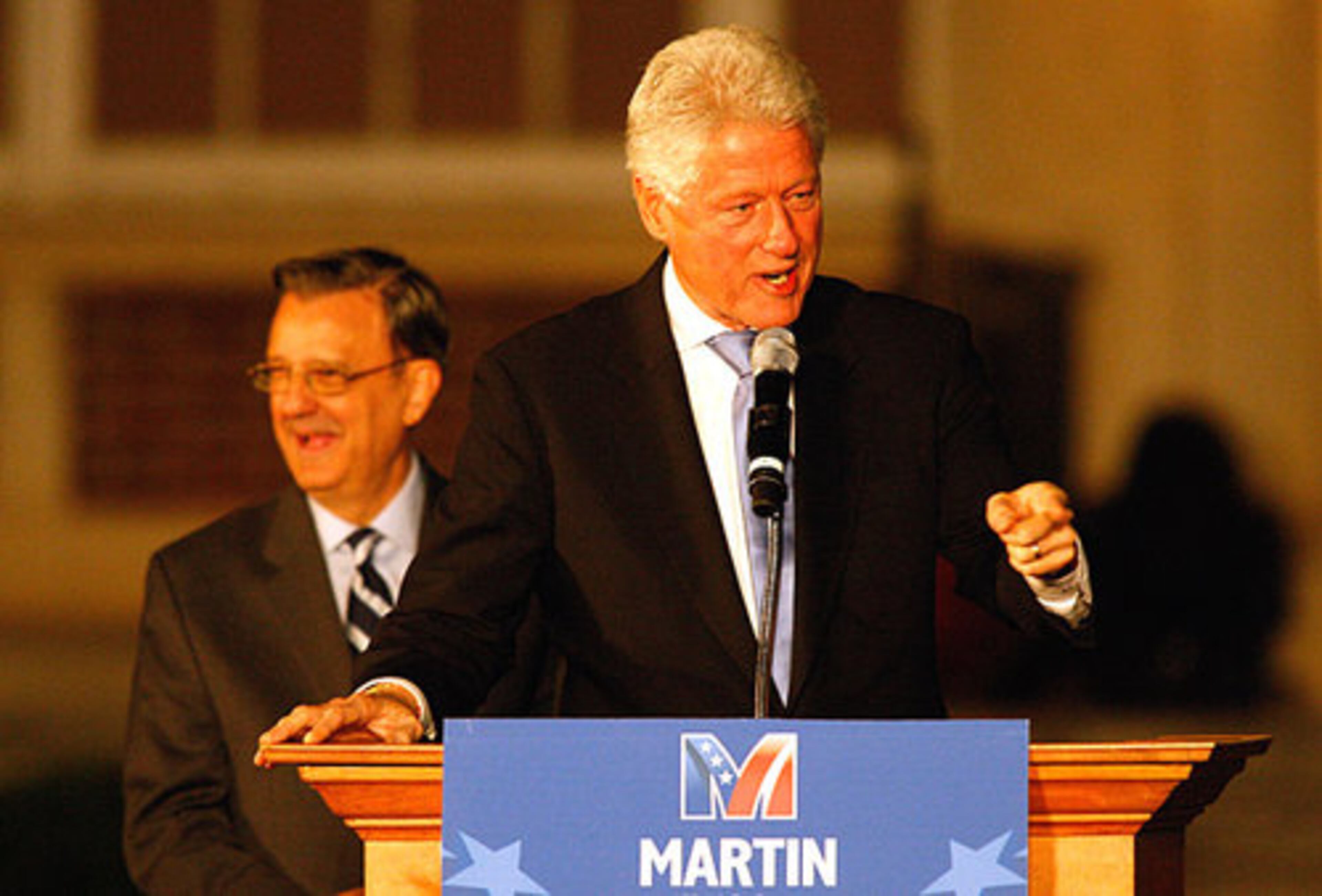 Martin (left) faces incumbent Republican Saxby Chambliss in a Dec. 2 runoff. Clinton told the crowd that the "person who wins this election will be the one whose supporters want it the most."