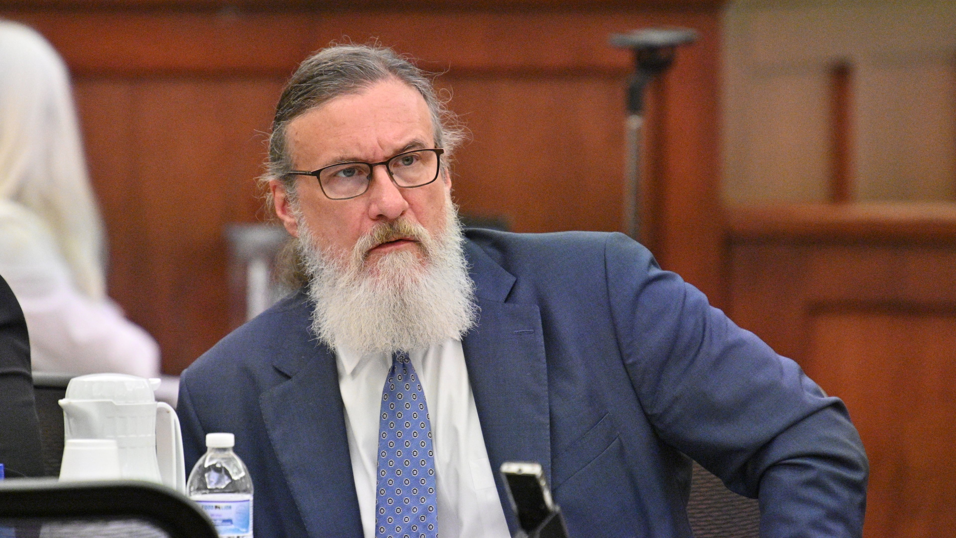 January 31, 2022 Americus - Attorney William McCall Calhoun sits next to his client Deontrey Parker (not pictured) during jury selection for alleged drug-related murder trial before Superior Court Judge Jimmie Brown (not pictured) at Sumter County Courthouse in Americus on Monday, January 31, 2022. Americus attorney William McCall Calhoun is out on bond and facing felony charges related to his activities at the U.S. Capitol on Jan. 6, 2021. While on bond, he is subject to home confinement and GPS monitoring (ankle monitor). (Hyosub Shin / Hyosub.Shin@ajc.com)