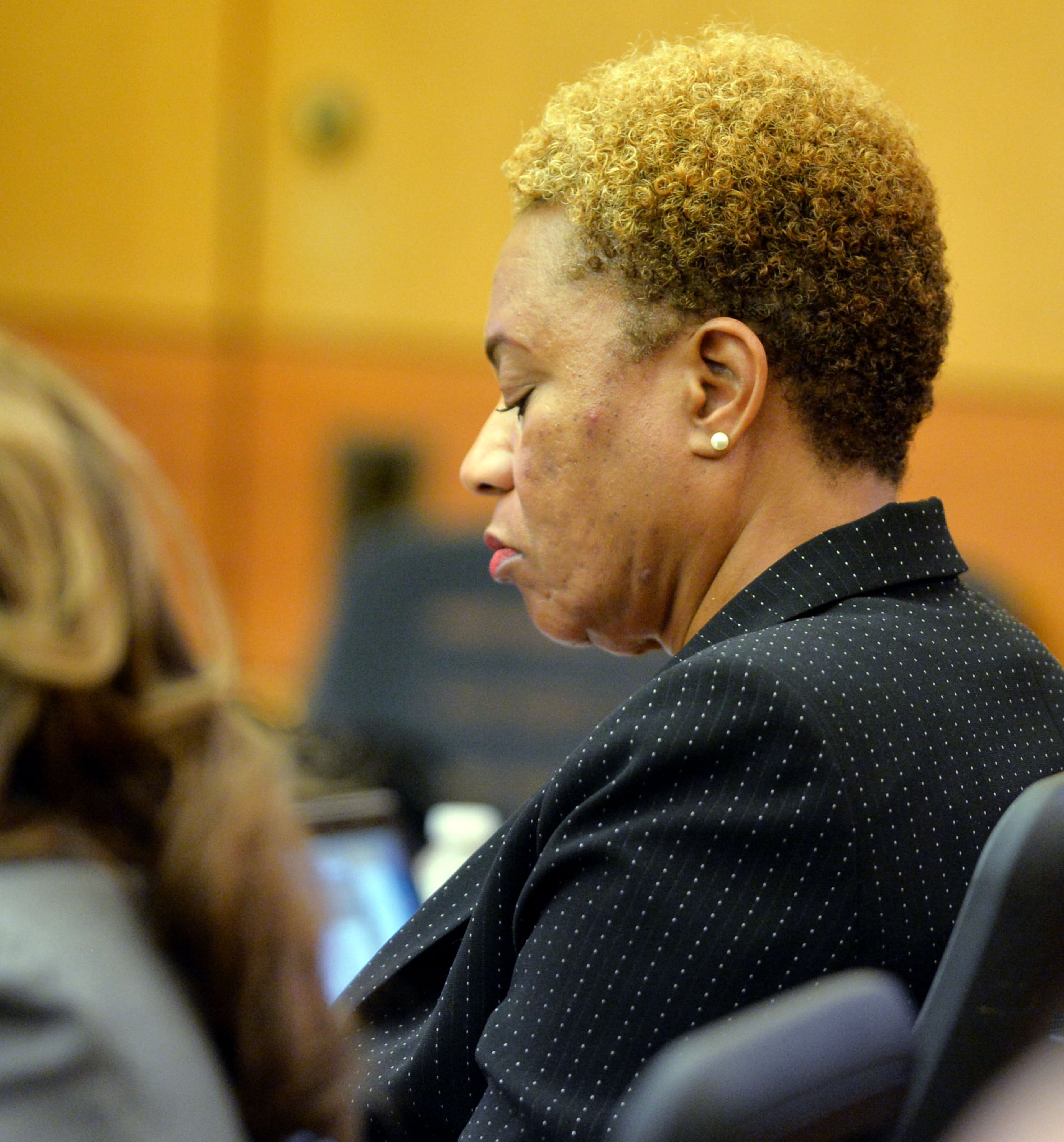Defendant Sharon Davis Williams listens to the prosecution opening statement. The prosecution lays out its case during an expected three-hour-long opening statement to kick off the Atlanta Public Schools test-cheating trial before Judge Jerry Baxter in Fulton County Superior Court, Monday September 29, 2014. Not all 12 defense lawyers will be making opening statements; some are planning to reserve theirs until after the prosecution presents its case. KENT D. JOHNSON / KDJOHNSON@AJC.COM