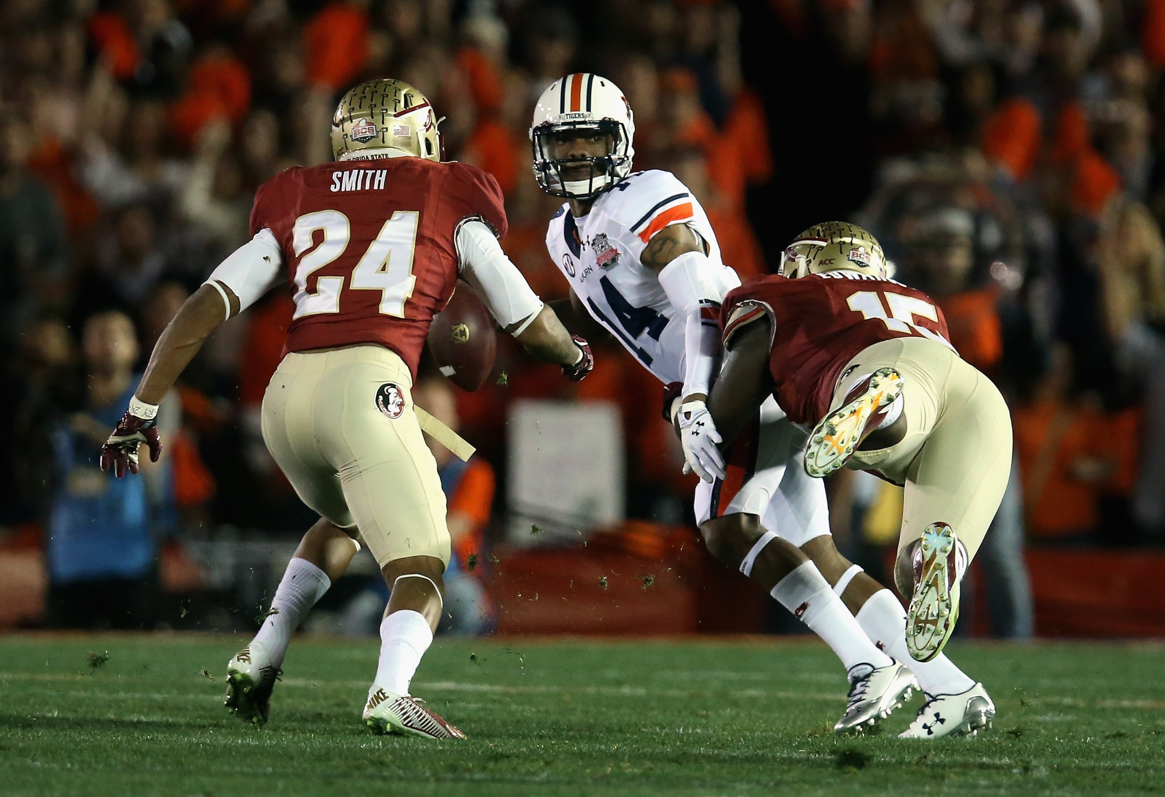 Quarterback Nick Marshall of Auburn is hit by defensive end Mario Edwards Jr. (15) of Florida State during the BCS Championship game on Jan. 6, 2014 in Pasadena, Calif. (Photo by Stephen Dunn/Getty Images)