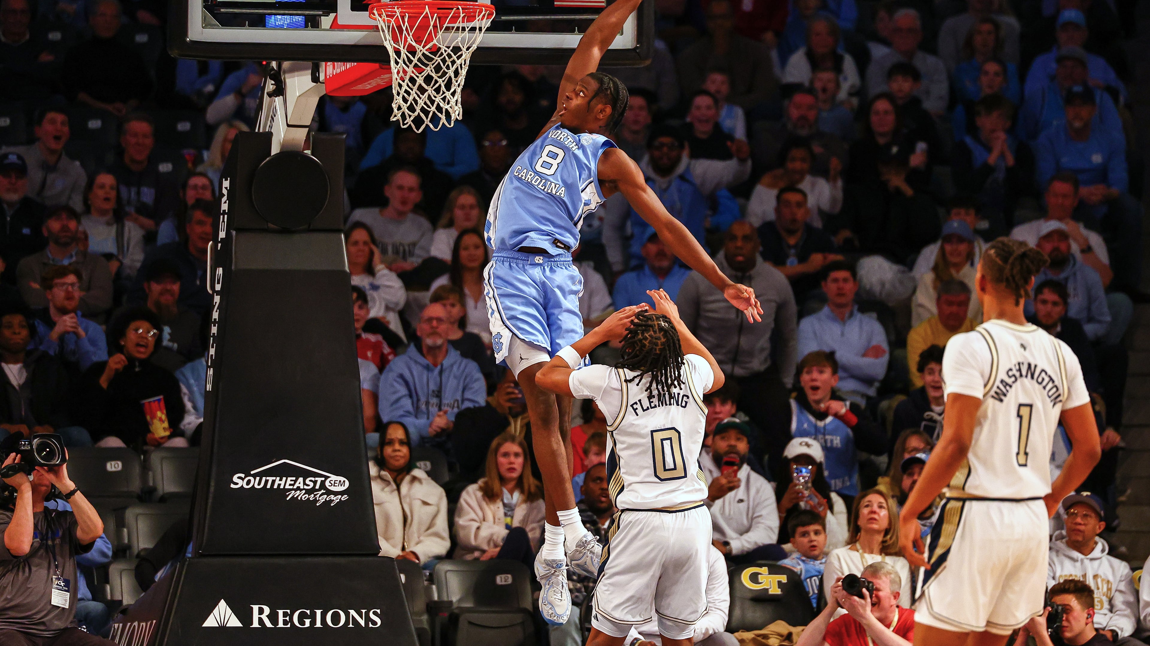 North Carolina forward Caleb Wilson (8) dunks over Georgia Tech guard Akai Fleming (0) during the first half of an NCAA college basketball game, Saturday, Jan. 31, 2026, in Atlanta. (AP Photo/Colin Hubbard)