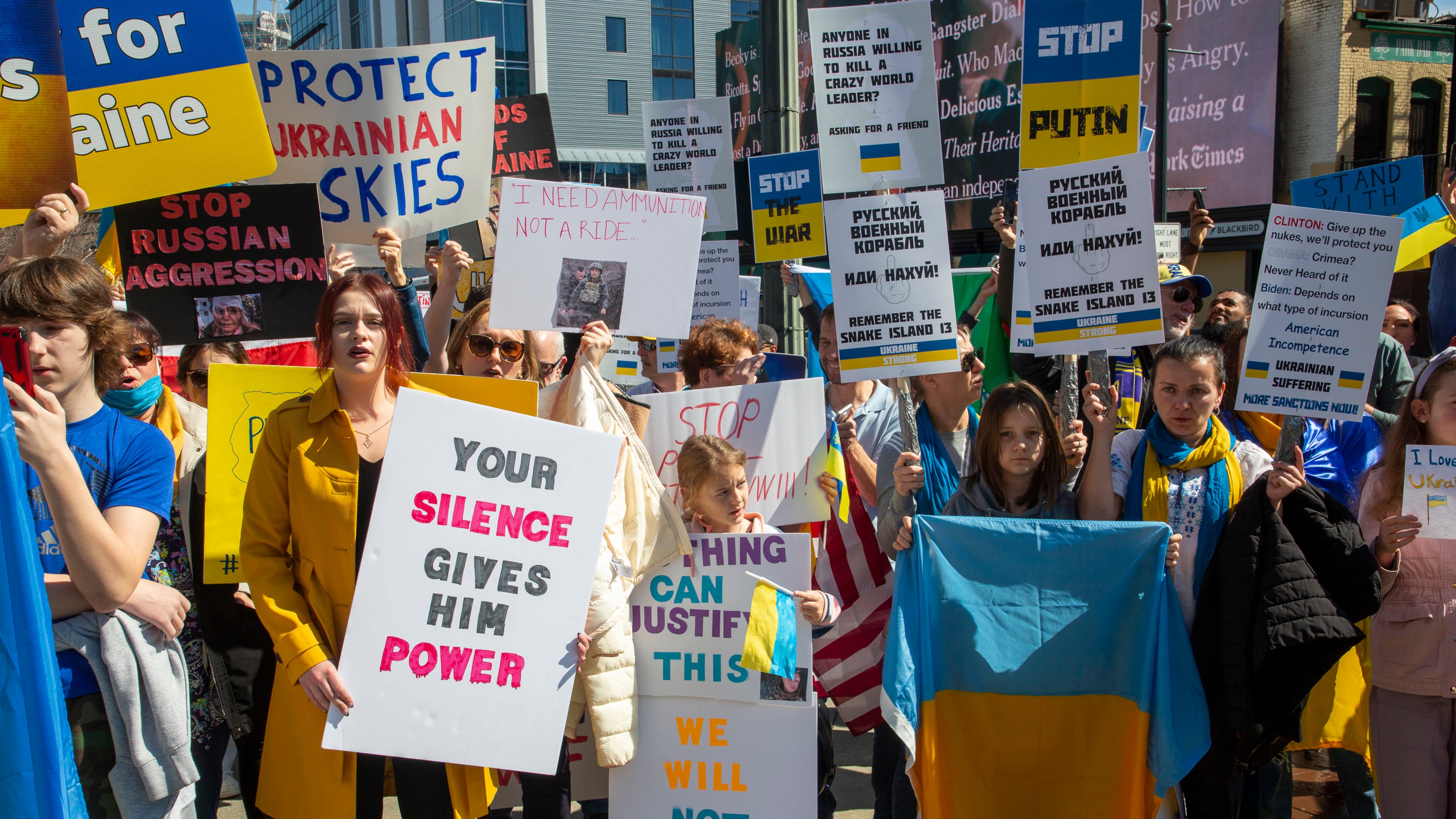 People show their support for Ukraine during a rally near the CNN center Saturday, February 26, 2022. STEVE SCHAEFER FOR THE ATLANTA JOURNAL-CONSTITUTION