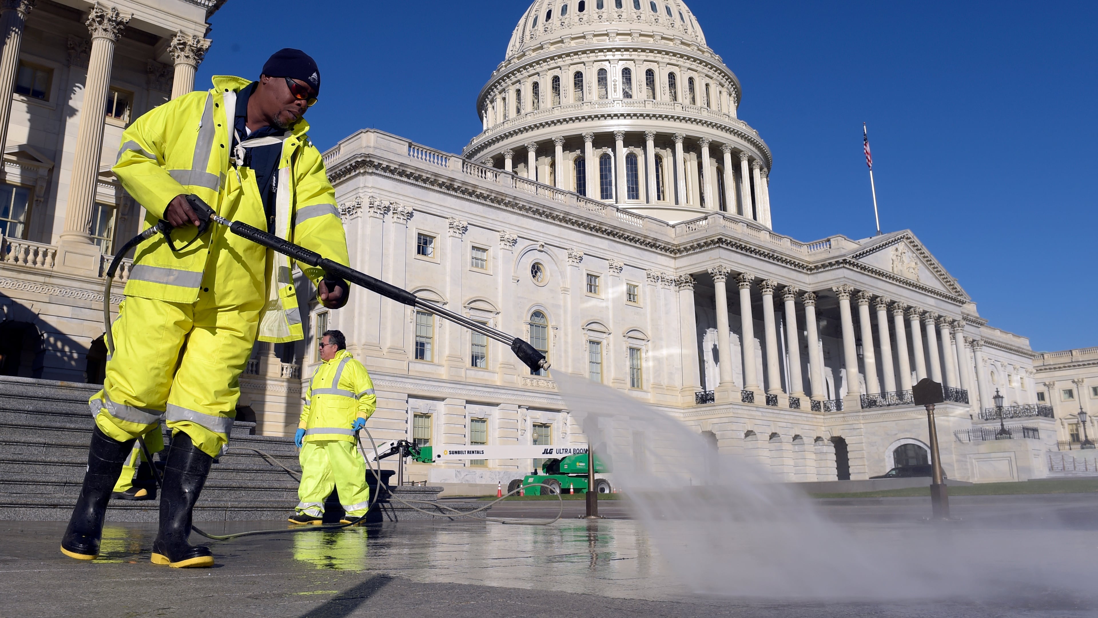 Carroll Rodgers of Suitland, Md., cleans the steps on Capitol Hill in Washington on Election Day. (AP Photo/Susan Walsh)