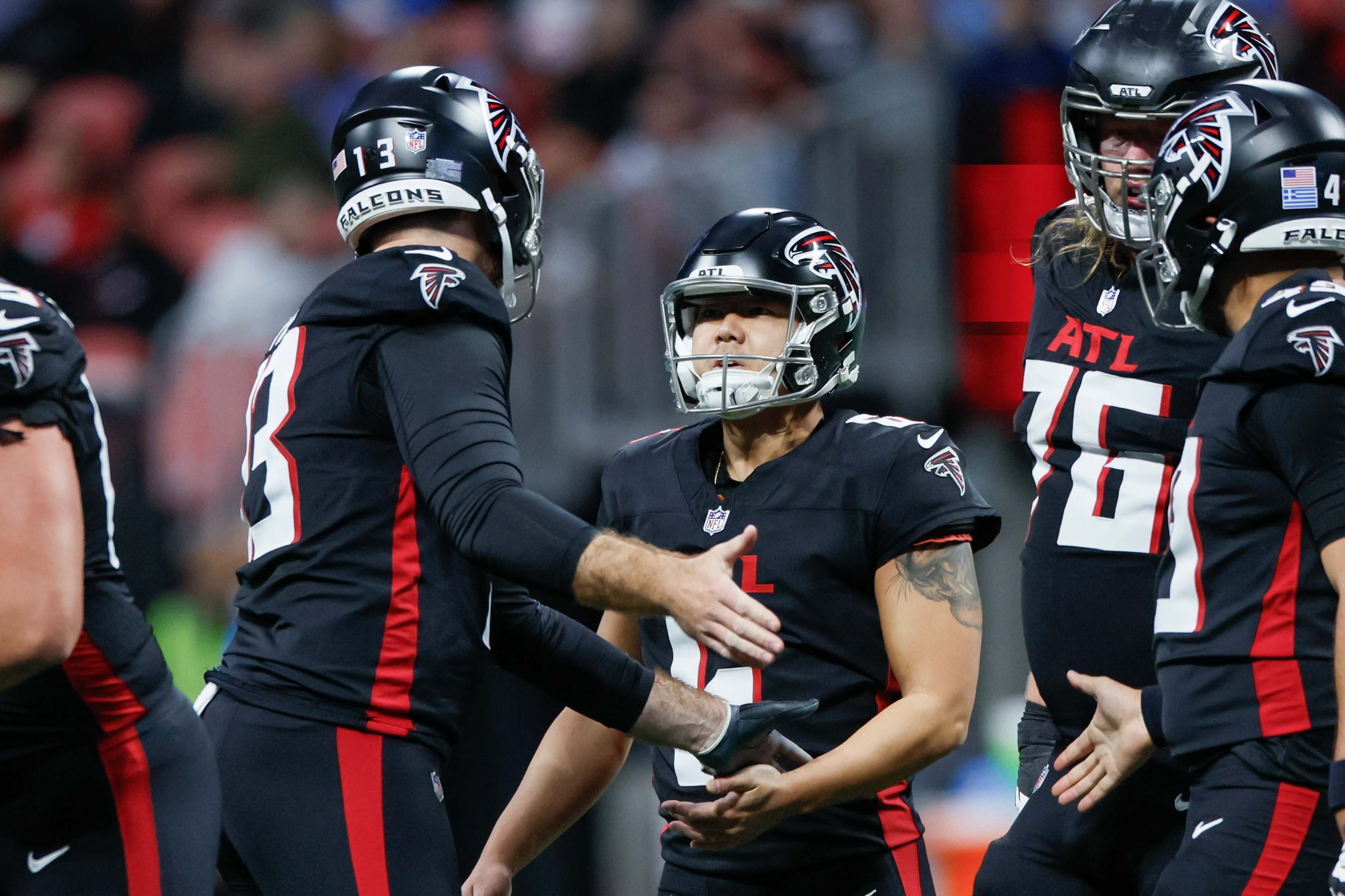Atlanta Falcons punter Bradley Pinion (13) speaks with Atlanta Falcons place kicker Younghoe Koo (6) after missing a field goal during the first half of an NFL football game against the Los Angeles Chargers on Sunday, December 1, 2024, at Mercedes-Benz Stadium in Atlanta.
(Miguel Martinez/ AJC)