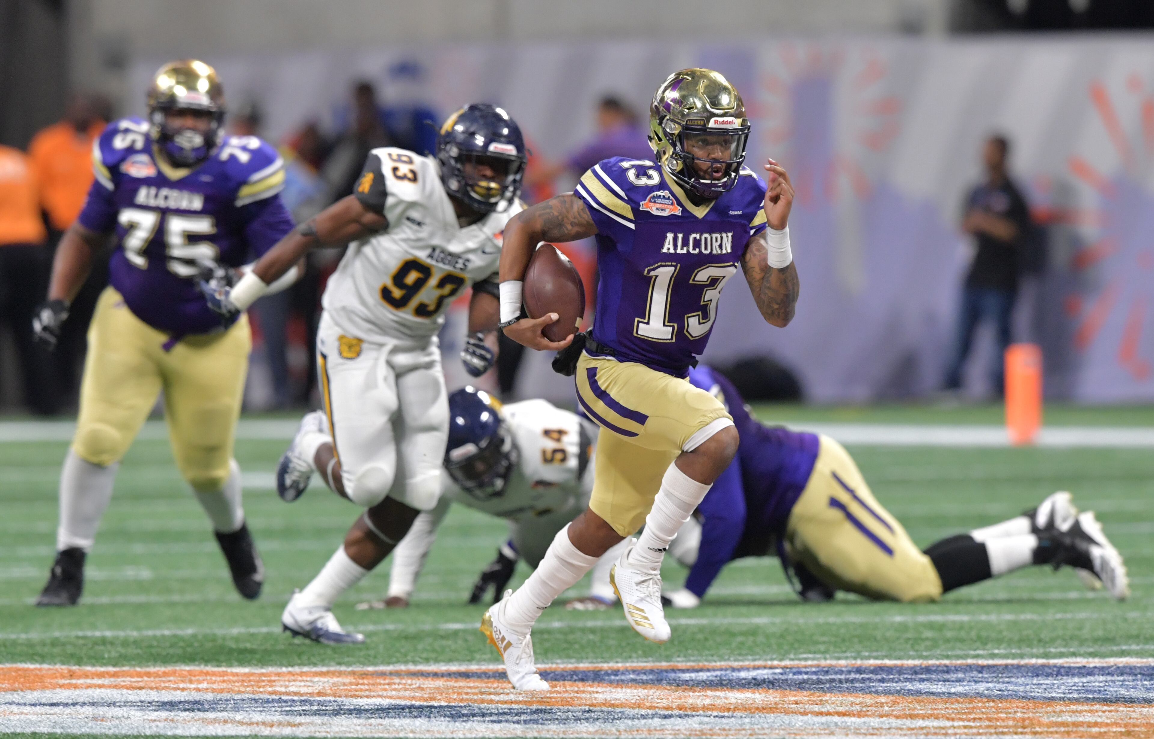 December 15, 2018 Atlanta - Alcorn State quarterback Noah Johnson (13) runs for a touchdown during the second half of the 2018 Celebration Bowl at Mercedes-Benz Stadium on Saturday, December 15, 2018. North Carolina A&T won 24-22 over the Alcorn State. HYOSUB SHIN / HSHIN@AJC.COM