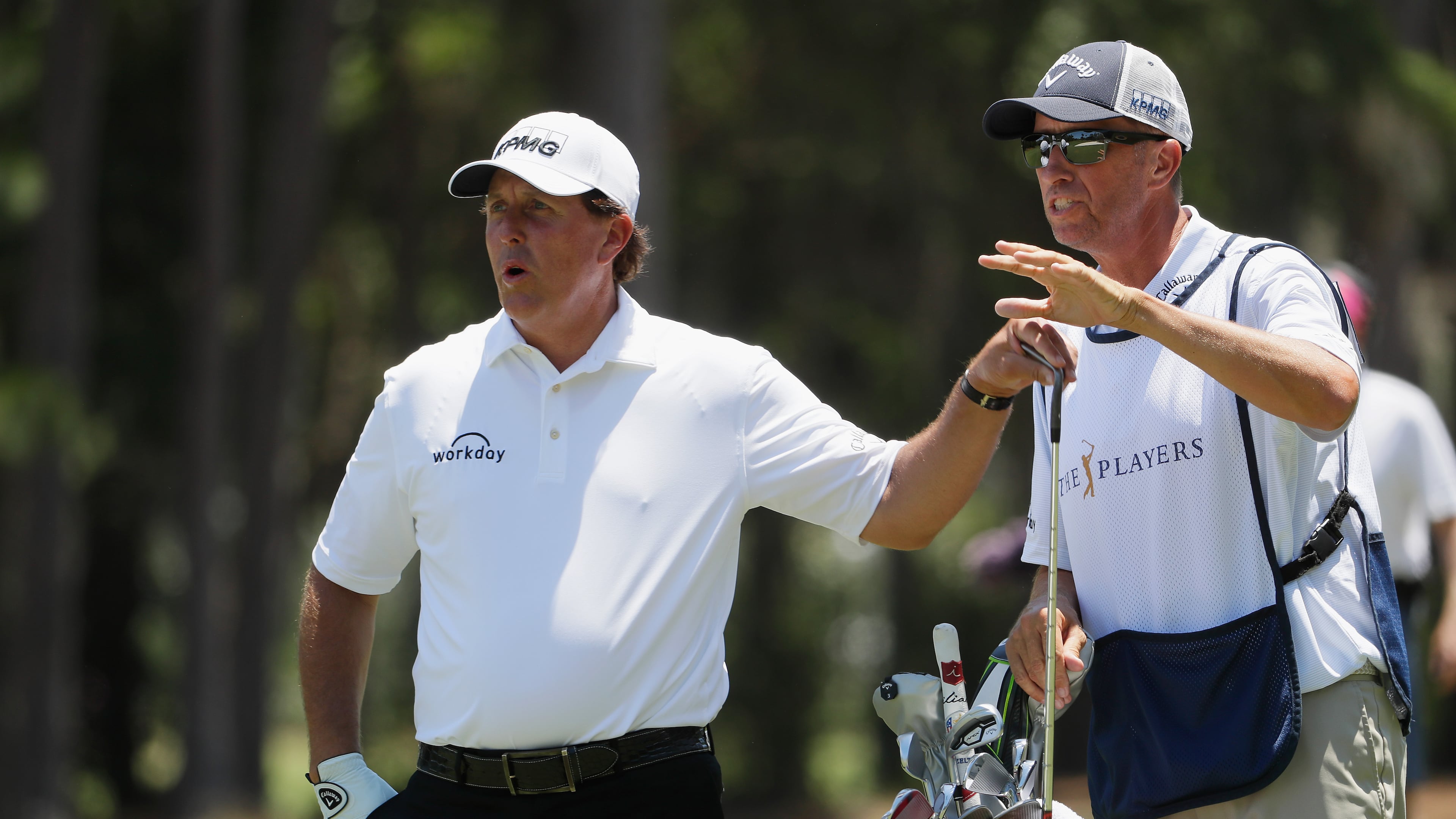 Phil Mickelson and his left-hand man, caddie Jim Mackay, plot a shot at this year's Players Championship.(Jamie Squire/Getty Images)